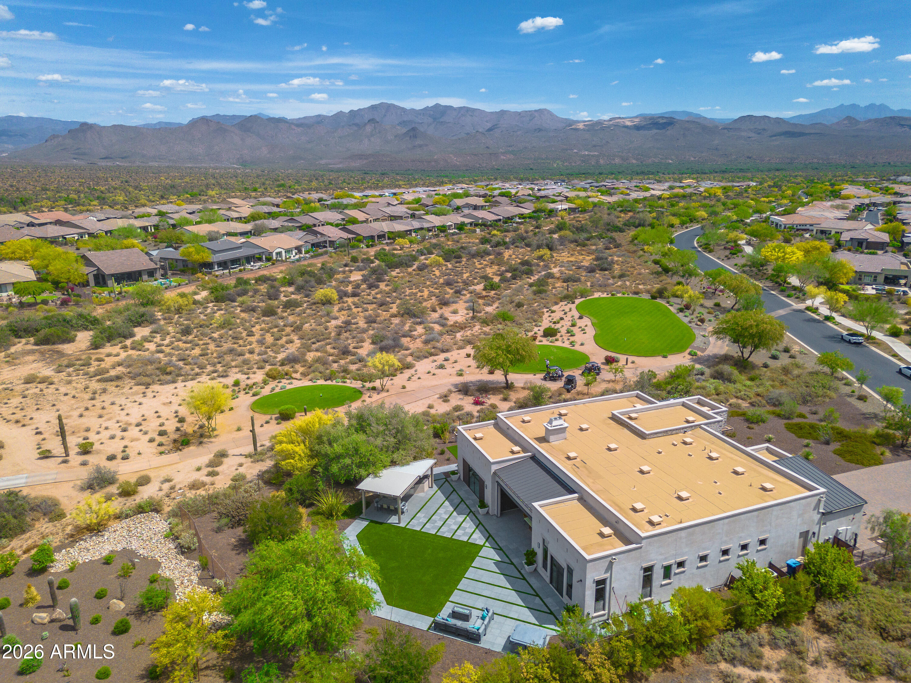 Luxury Defined - Modern Designed - Golf Course Living. Serene mountain views. Sunsets served daily. Trilogy all-in amenities including a resort-style community pool you don't have to clean! Hot tub star gazing. Fireplaces inside & out mesmerizing. The perfect lock & leave - no pool, no hassle, xeriscape, hardscape, smart home is controllable around the world. Fleetwood doors, Subzero fridge, wet, wine & coffee bars, soaring 14 foot ceilings, super shower, dual everything, guest casita ... all that you want and more to boot. Premium lot w/ only 1 neighbor, the rest is golf course and mountains, no walls, no roads here. Outdoor shaded kitchen as it should be, dynamic landscape, disappearing doors, automated full patio dropdown screen. The lifestyle of dreams is HERE! See MORE Golf course lot " Mountain views " Attached guest casita " 14' ceilings " Smart home system

Single-level contemporary Desert Modern home on an oversized ~26,000 SF golf course lot in Trilogy at Rio Verde.  Positioned for mountain views and low maintenance lock and leave living, with multiple covered patios, outdoor kitchen, water features, hot tub spa, and gas fireplaces designed for indoor-outdoor living. 

Great room features 14' ceilings, gas fireplace, and fully retractable Fleetwood glass wall opening to outdoor living areas. Kitchen includes waterfall-edge island, Sub-Zero fridge, induction cooktop, double convection ovens, drawer microwave, walk-in pantry, coffee bar, and extensive storage with all the drawers.  Attention to every detail with cascade counters, a flawless backsplash, and abundant storage ... a gourmet chef's dream kitchen.  

Primary suite includes dual vanities, oversized walk-in shower with dual entry, expansive primary walk-in closet, and direct access to your hot tub and outdoor patios. Secondary bedroom includes en-suite Jack & Jill bath, walk-in closet, and patio access with an outdoor fireplace and sweeping mountain views. Attached guest casita includes private entrance, en suite and separate living space. 
Additional features include dedicated office with natural light, bonus/game room with wet bar and sliding glass walls, wine bar with multiple beverage refrigerators, and large-format tile flooring throughout.

Exterior includes screened dining patio for pest free year round use, built-in BBQ, geometric hardscape with low water no maintenance turf, and multiple seating areas oriented toward golf course and mountain views.

Home includes Crestron smart home automation system controlling lighting, HVAC, security, and audio from any phone anywhere in the world. Additional features include two tankless water heaters, whole-home water filtration, insulated noise barrier interior walls, and oversized 3-car garage with built-in storage.

Home built for entertainment inside and out. You can have a golf membership and attain the country club prestige you desire.  
Includes access to Trilogy at Rio Verde world class amenities with golf, fitness center, resort style pools, dining, and community spaces. True elegance, luxury, lock and leave ... lifestyle.
