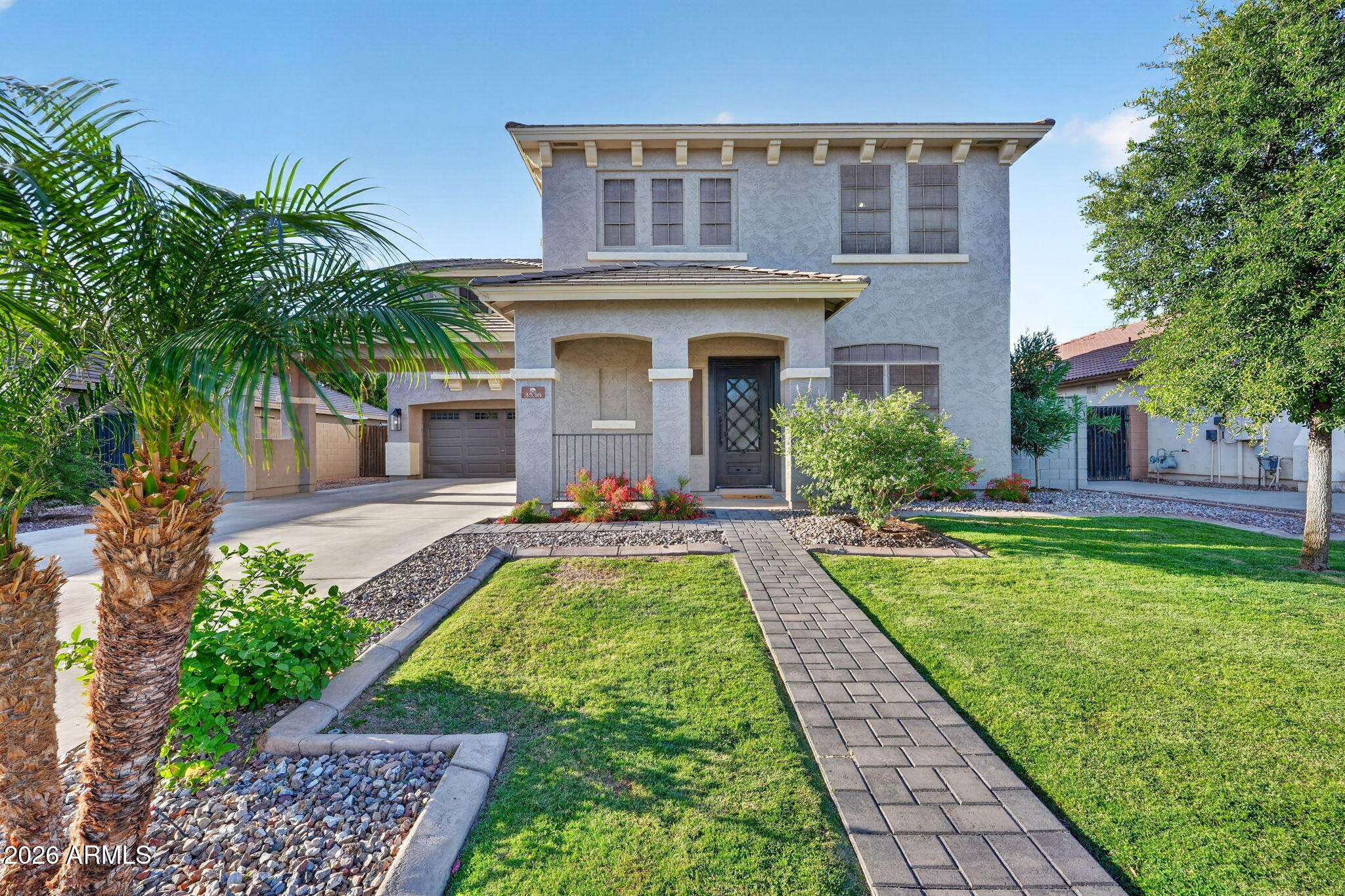 Welcome to this stunning 5-bedroom, 2.5-bath home located in the heart of Gilbert! Showcasing true pride of ownership, this beautifully maintained property offers the perfect blend of comfort, style, and functionality.

From the moment you arrive, you'll appreciate the impressive curb appeal featuring a huge driveway, four-car tandem garage, RV gate, and lush grassy front yard. Step inside to discover soaring vaulted ceilings, designer paint tones throughout, and spacious formal living and dining areas designed for both entertaining and everyday living.

The remodeled dream kitchen is the centerpiece of the home, featuring upgraded stainless steel appliances, abundant cabinetry with crown molding, tiled backsplash, recessed lighting, and a large center island with breakfast bar seating The backyard is truly summer-ready with newly installed grass, a sparkling pool, covered patio, and relaxing sitting area ideal for entertaining or unwinding after a long day.

Conveniently located near shopping, restaurants, and easy access to Loop 202, this exceptional Gilbert home offers the lifestyle you've been looking for.