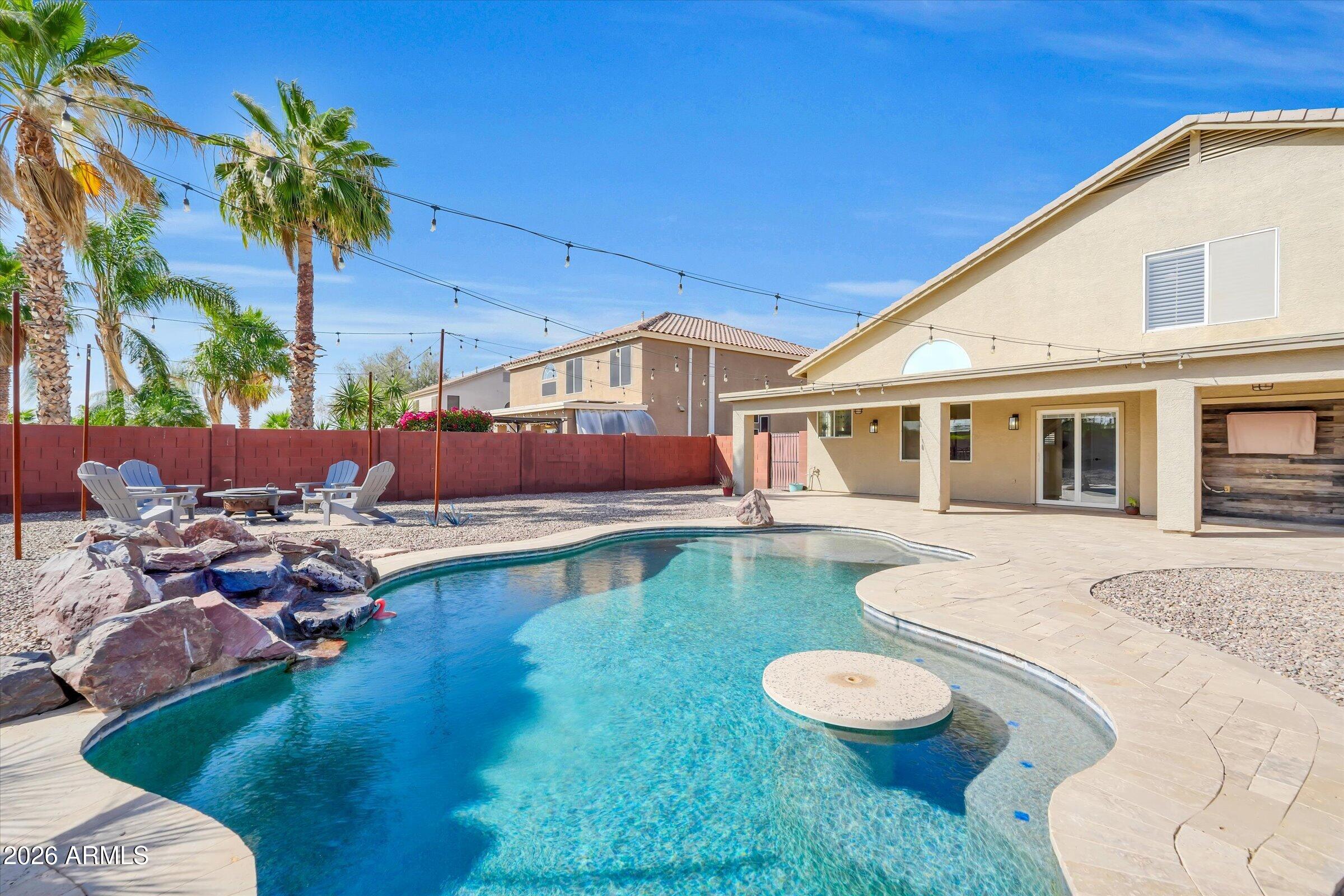 Step into this beautifully upgraded 4-bedroom, 2.5-bath home featuring a resort style backyard with sparkling private pool. Gorgeous features as soon as you walk in the front door, from beautiful hardwood tile, a cozy fireplace, soaring ceilings, and shutters throughout! Gourmet kitchen features a large butcher block island, gas stove, granite counter tops, and plenty of cupboards. The primary suite boasts a luxurious ensuite spa-like bath with dual vanities and huge walk-in shower. Additional highlights include updated laundry and bathrooms, designer lighting, new AC system in 2025, and a generous three-car garage with extended driveway and RV gate. Stroll outside to your own backyard oasis with covered patio, heated pool, and lush landscaping--ideal for relaxing or hosting gatherings. Conveniently located near top-rated schools, shopping, and parks, this move-in-ready home checks every box!
