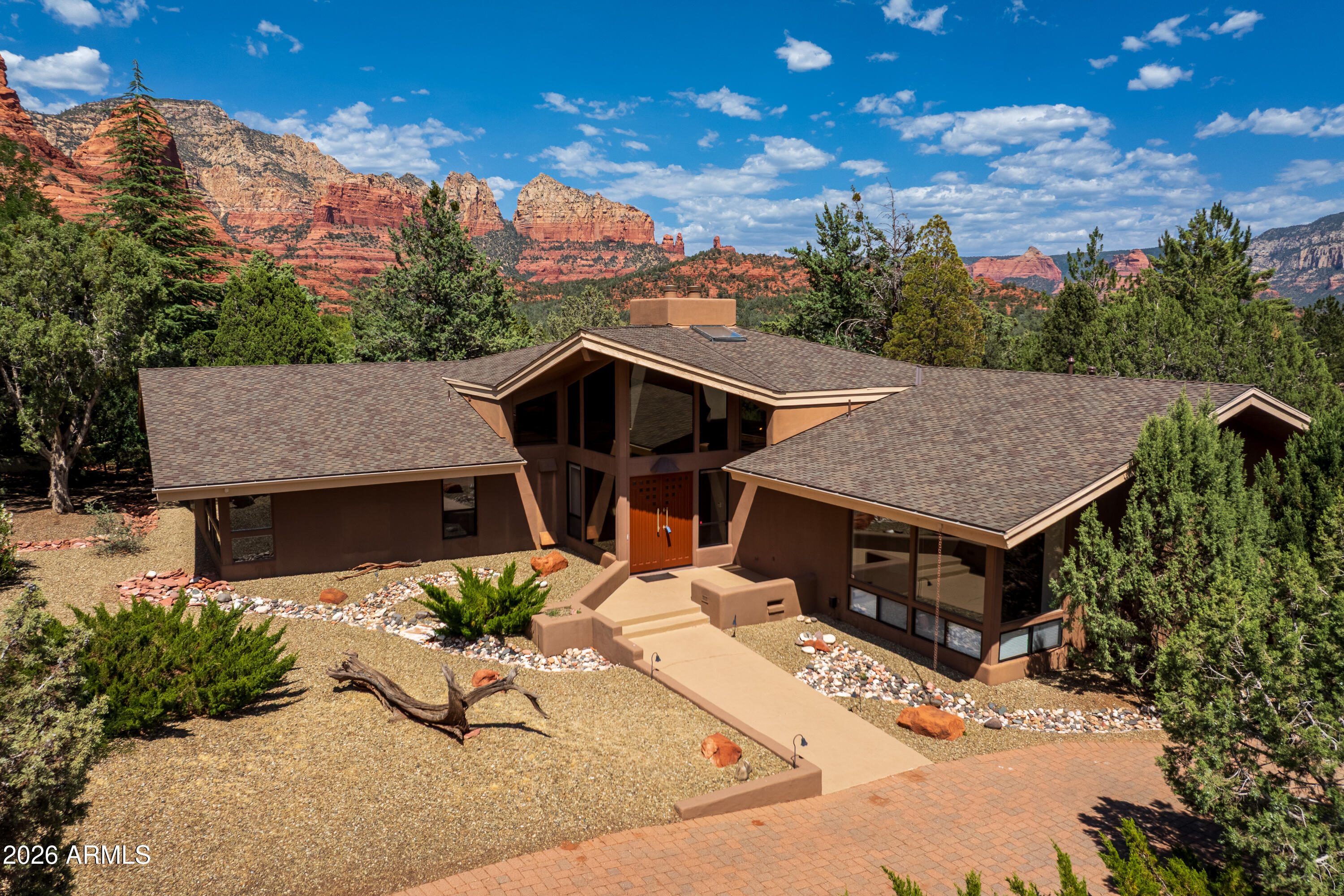 Experience the majesty of the Soldiers Pass Corridor's stunning views and priceless setting surrounded by National Forest. An architectural contemporary gem that showcases the famous Coffee Pot rock formation. This single level, flowing floorplan boasts a gourmet kitchen, magnificent vaulted great room and 3 bedrooms plus family room/office. Light flows abundantly through expansive windows taking your breath away. Rare red rock views from the back yard sets the mood for serenity. Spacious rooms throughout plus an oversized garage. One of a kind Estate Sized Lot describes this unique residence. A dream come true!