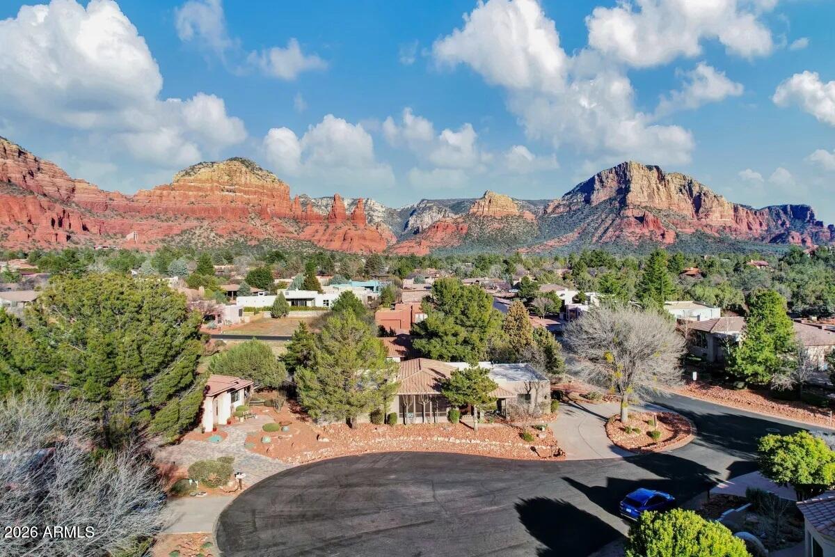 Experience the best of Sedona living in this beautifully renovated, turnkey retreat tucked away on a quiet cul-de-sac with no HOA. Offering 3 bedrooms, 2.5 bathrooms, and 2,305 square feet, this exceptional property blends luxury, comfort, and investment potential in one of Sedona's most desirable locations.

Thoughtfully updated throughout, the home features newer flooring, updated finishes, newer appliances, and spacious living areas designed for both everyday living and entertaining. The open floor plan creates a seamless flow between indoor and outdoor spaces, allowing you to fully embrace Sedona's breathtaking surroundings Step outside to your own private resort-style backyard. Designed for relaxation and memorable gatherings, the outdoor space features lush turf, extensive paver patios, a hot tub, fire pit, swing, and multiple seating areas that invite you to enjoy Sedona's year-round sunshine and spectacular starlit skies.

Whether you're searching for a primary residence, second home, or investment opportunity, this property delivers. With a proven and successful short-term rental history, it offers the flexibility and income potential that today's buyers are seeking.

Recent improvements provide peace of mind, including a fully repaired roof with a 10-year warranty, newer HVAC system and water heater, newer appliances, and numerous upgrades throughout the home.

Ideally located just minutes from Sedona's renowned hiking and biking trails, world-class dining, shopping, art galleries, and outdoor recreation, this is a rare opportunity to own a fully renovated Sedona retreat that is as functional as it is beautiful.