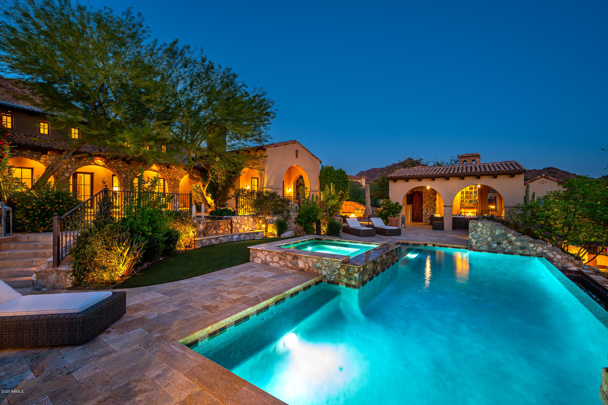 Stunning Rural Mediterranean-style home in the Upper Canyon of Silverleaf! This 7,693 sf property is on nearly 1.4 acres and is the ultimate in fine desert living.  Extensively remodeled in 2018, upgraded features include a premium kitchen with Wolf appliances, wide plank Belgian white oak flooring, antique handcut French limestone fireplaces, decorative limestone detailing and copper stand-alone tub in master bathroom, and handsome millwork and wood beams throughout. Thoughtful outdoor living spaces created at entry courtyard, covered back patio, and 2 cabanas that book-end the pool - for nearly 2800 sf of total outdoor covered space! Floorplan also features a 660 sf two-room guest house off the entry courtyard, a bonus room with wetbar and view deck, walk-in wine room, separate entry executive office, master suite on the main level, and 4 car garage. Home also includes a Crestron whole house automation system, 6 fireplaces plus firepit, 2 outdoor showers, hot water recirculation pump and much more. Great location providing both estate home privacy and convenience with two manicured parks just a block away. This is the perfect home for a buyer who wants elegance but yet still wants a sense of neighborhood.