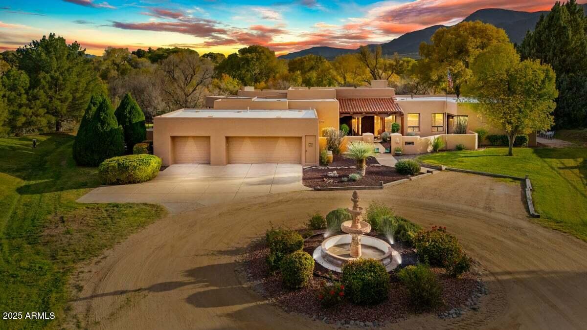 This Stunning home sits in on 5.94 irrigated acres that backs the VERDE RIVER!  This is a rare find with so much property overlooking the lush green lawn all the way to the river.  Home is in the Rio Verde Ranchos subdivision which is one of the finest in the Verde Valley.  This home boasts 3800 sq ft of indoor living at its best, Three full suites with private baths, doors exit to patios.  Floor to ceiling windows from most rooms. Bright and Open floorplan with gourmet kitchen. Huge library /office, the dinning room opens to pool, patio, BBQ, fireplace and jacuzzi, outdoor shower and a pool.  Large back patio for enjoying the river and wildlife.  Tons of storage, big laundry and a wine room!  It has been recently upgraded, some new flooring new interior and exterior paint.  A must see