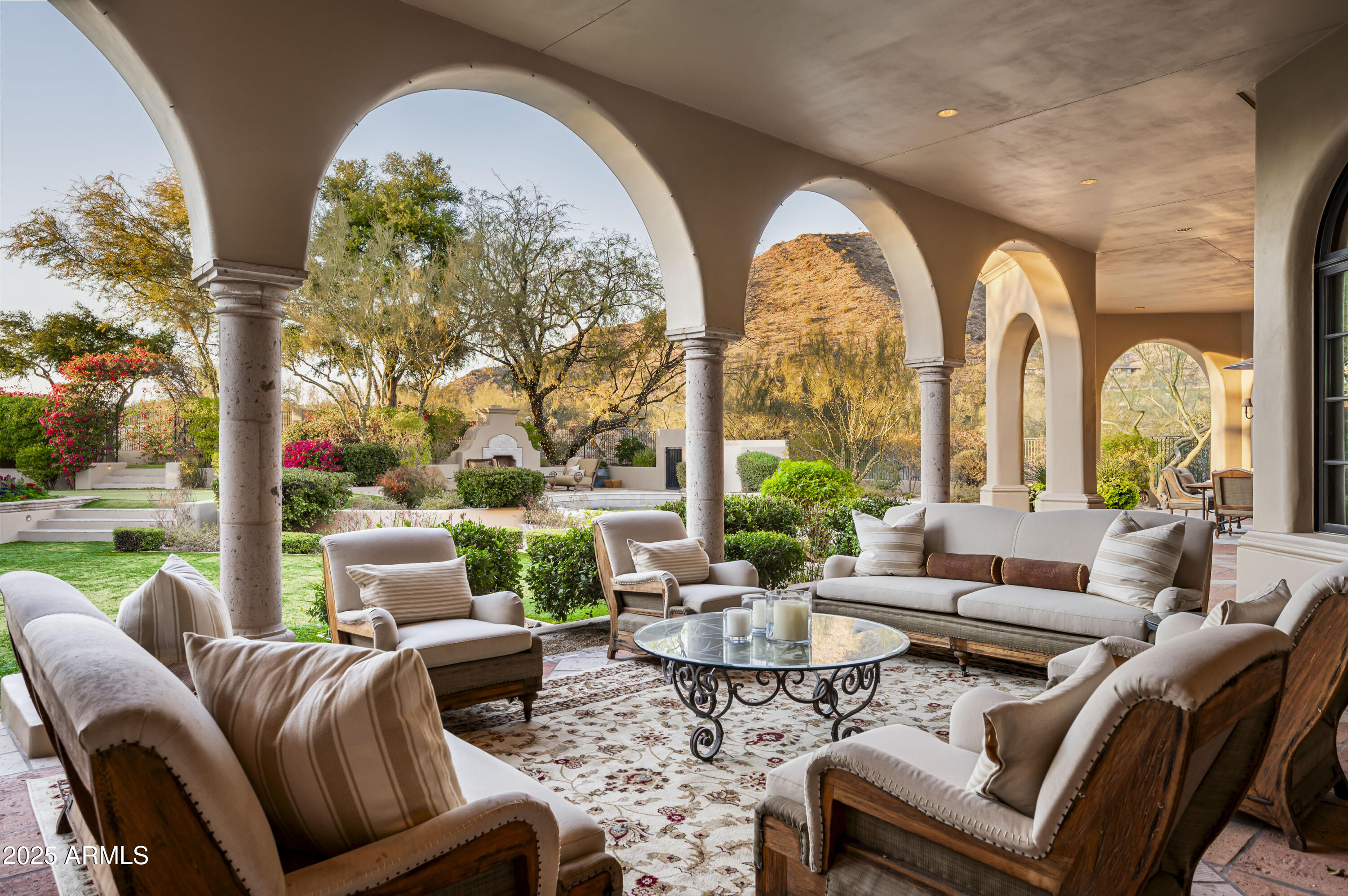 Discover the ultimate in Arizona living with this recently updated hacienda-style home, located on the best canyon lot in the exclusive Country Club at DC Ranch. This stunning custom Spanish home sits on approximately five (5) acres of preserved land and offers a rare combination of breathtaking mountain views, unrivaled privacy, and exceptional craftsmanship. This classic estate feels much bigger than its 6,159 square feet, with an additional 2,200 square feet of outdoor living under roof, affording unobstructed and dramatic canyon views. Inspired by the timeless charm of the Hermosa Inn, this residence offers a resort-like feel, making it the perfect escape from the everyday, like your very own private retreat, with unparalleled seclusion and tranquility. Built by renowned Nance Construction, this home is a true sanctuary, offering an expansive floor plan that seamlessly blends indoor and outdoor living. The primary suite is a standout feature of this home, offering an exceptional layout with a private patio, charming views, and bathroom with "his and her" vanities, closets, and toilets, providing ultimate convenience. Whether you're enjoying the spectacular mountain vistas, relaxing by the pool, or entertaining in the meticulously designed spaces, this home is an oasis that offers the best of Scottsdale living. Indulge in the luxury, privacy, and exclusivity of your own private hacienda where every day feels like a vacation. The build-able site is 1.35 acres, with additional land available to build an expansive guest house or expand the current home. A home in this location rarely comes on the market, you must see it in person to appreciate it.