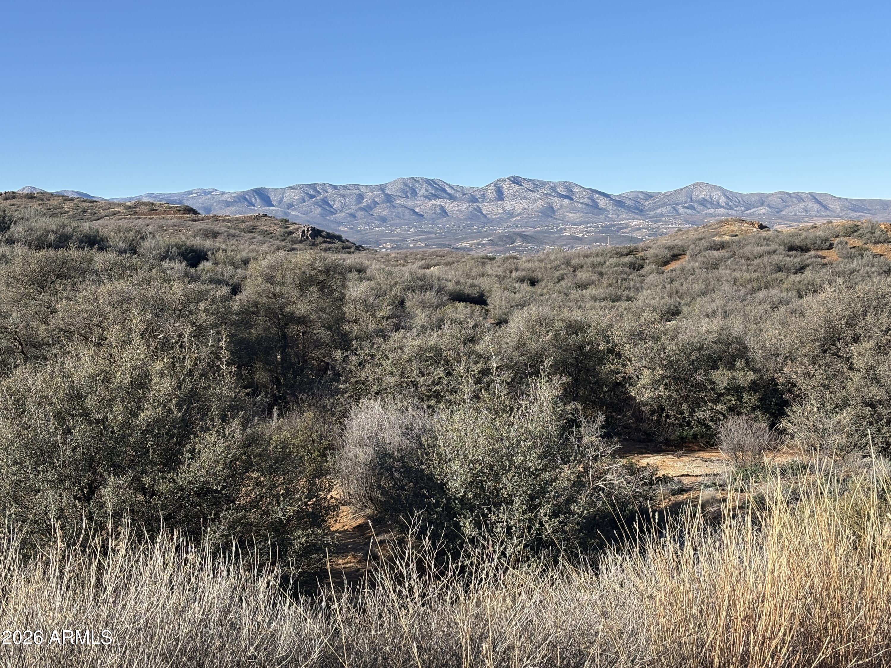 Located just outside the charming town of Dewey, Arizona, this beautiful 2.01-acre parcel in the sought-after Estates at Cherry Ridge offers the perfect blend of space, scenery, and accessibility. The vacant land features gently rolling hills, wide-open skies, and incredible views that capture the natural beauty of the area. With easy access to AZ-169, getting to and from the property is simple, while still enjoying the peace and privacy of rural living.

Estates at Cherry Ridge is a well-planned, platted subdivision known for its maintained roads and welcoming sense of community. This is a place where neighbors take pride in their surroundings and where it's easy to imagine building a home that truly fits your lifestyle.