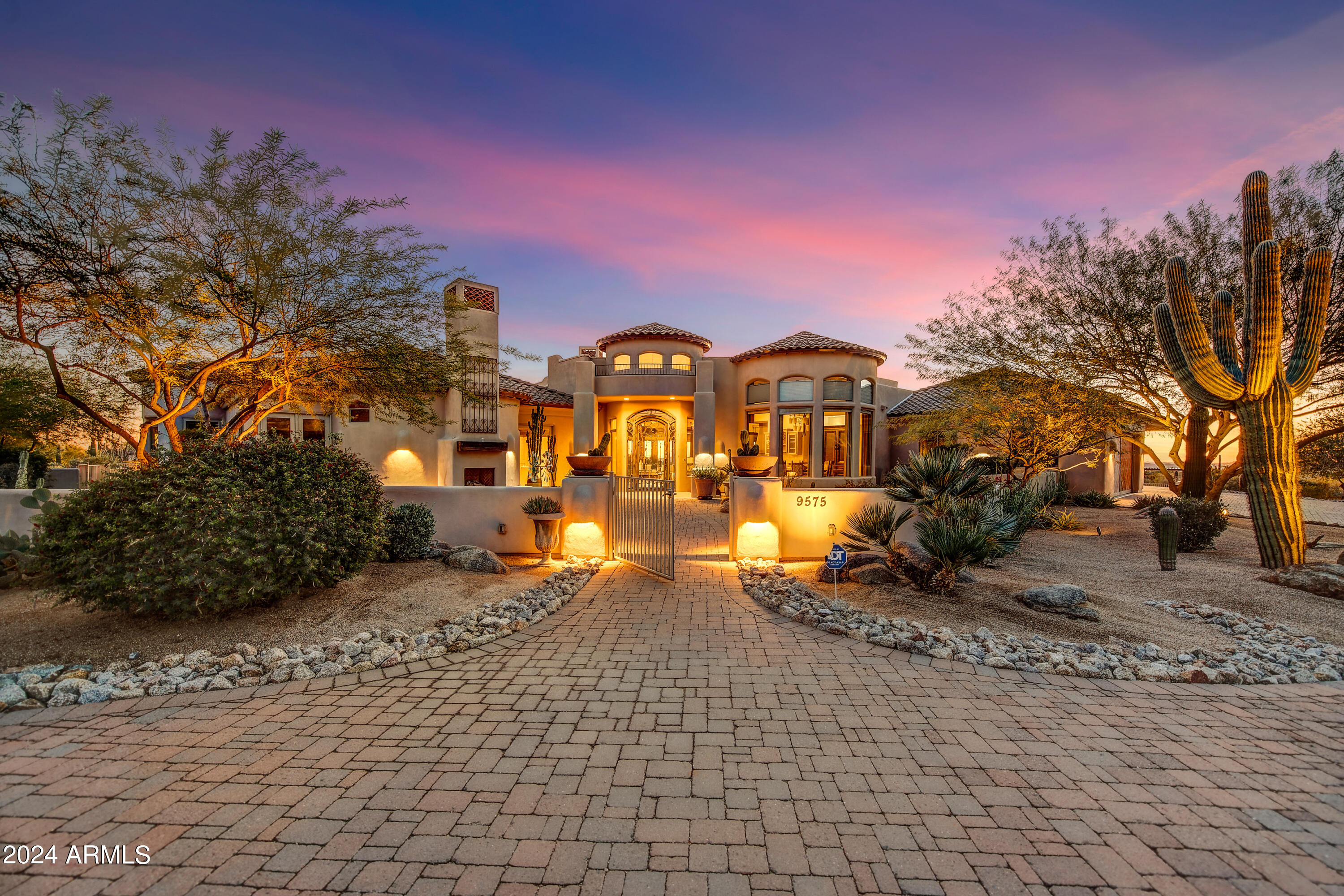 Fabulous custom home on 2+acres exuding SW charm. Views of Pinnacle Peak, mountain and city light views from almost every room! Single level with open floor concept. Heart of the home is the Great room with Gourmet Kitchen Dining area that all lead to multiple patios. The backyard oasis boasts lovely views with a renovated  heated pool & spa, waterfall, fire pit, large artificial turf area and built in BBQ.Front patio has exceptional views of Pinnacle Peak and great space for entertaining or just hanging with family.  Sunrise and Sunsets are stunning! Media room has wet bar, office with murphy bed,Large Primary bedroom with 2 walk in closets + additional area could be office or exercise room.