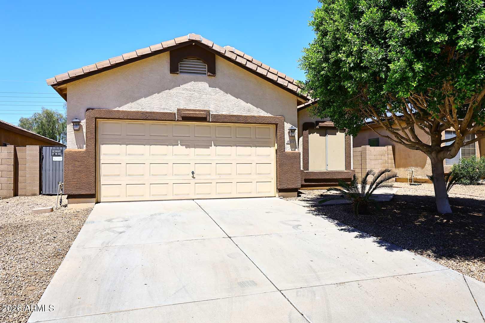 Better Pictures to follow within 48 hrs.......Looking for that 3 bedroom + Den/4th bedroom home, with a pool...? Here it is!  This wonderful home welcomes you w/soaring vaulted ceilings, split bedroom floor plan for privacy, an open concept great room and kitchen with island, SS Appliances, raised Hickory Cabinets, eat-in kitchen area that looks out to backyard pool & White Tank Mountains.. The large primary bedroom w/vaulted ceiling (all bdrms are vaulted) includes walk-in closet & private ensuite w/double sinks & separate tub & shower. The den/4th bedroom has lots of possibilities - (office, 4th bdrm or workout room?) The hallway includes a nice built in desk area.  A/C was replaced in 2024, New Carpet 6/26 and laminate flooring recently replaced.   Go look and see your new home ASAP...