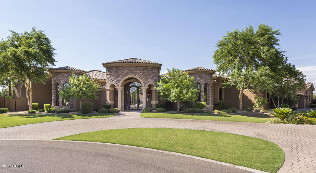 Meticulously constructed and designed, this property, with both Mediterranean and Spanish influences exhibits an exquisite design palette. From the soaring high ceilings with canterra stone accents, to the beautifully integrated travertine and hand scraped wood floors create an environment of elegance. Open living spaces lit with natural light caters to an open and airy environment. Whether entertaining a formal dinner gathering or a back yard bbq, this home transforms easily for any occasion. From the custom kitchen with gourmet appliances, multiple flex spaces and work station, to the  heated diving pool with water feature slide and diving board, this property offers a favorite space for everyone!