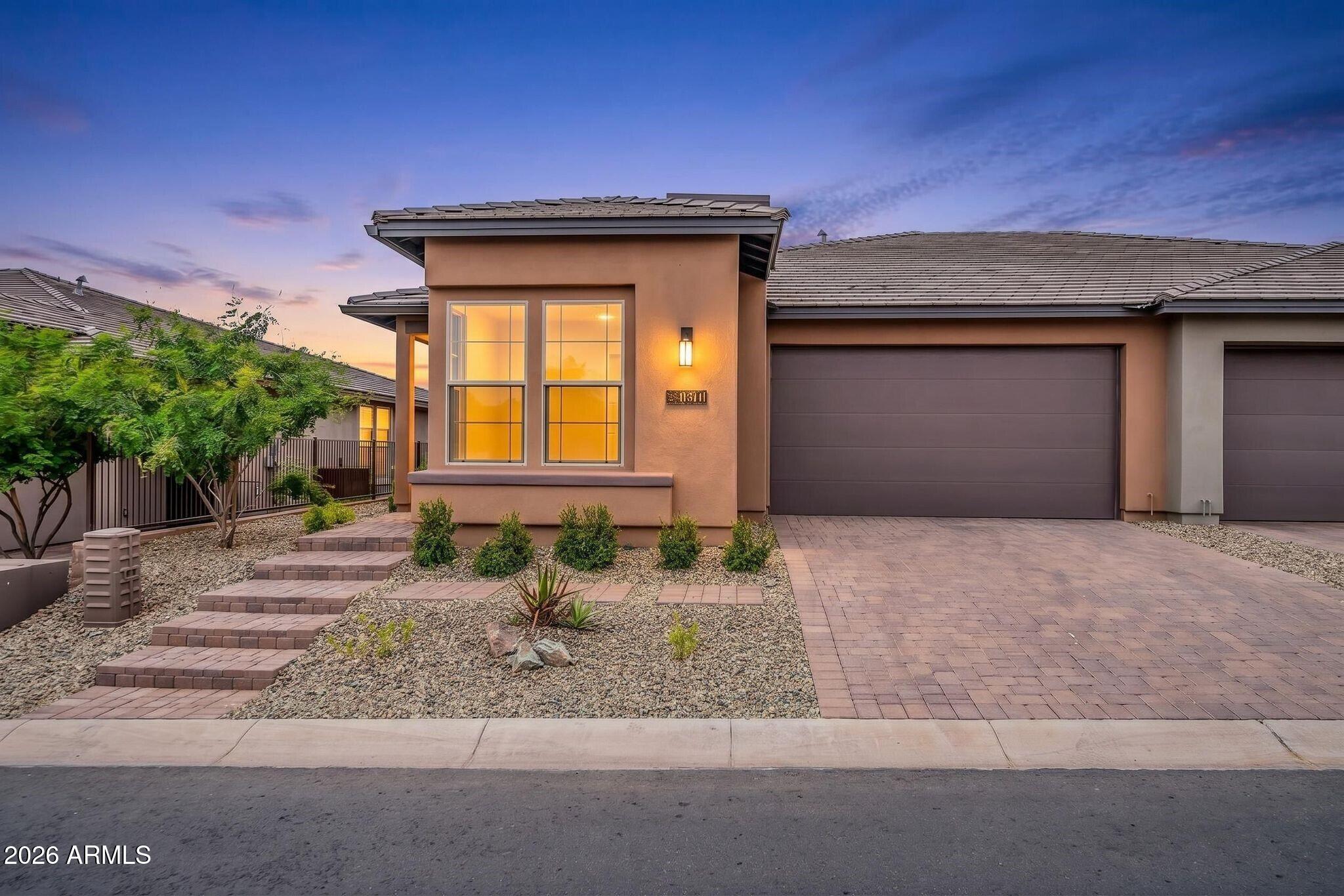 EXPERIENCE EFFORTLESS LIVING IN THIS LOCK-AND-LEAVE TOWNHOME AT TRILOGY VERDE RIVER GOLF & SOCIAL CLUB, OFFERED TURNKEY WITH STYLISH INTERIOR FURNISHINGS FOR IMMEDIATE ENJOYMENT. Designed with a beautiful upgraded contemporary aesthetic, the home features modern finishes, thoughtful upgrades and an inviting open feel. Home was designed with 2 ensuite primary bedrooms and built-in banquet seating in the dining area creating maximum flexibility for entertaining family & friends. Step outside to an extended patio complete with a pergola perfect for relaxing or entertaining while taking in gorgeous mountain views. Whether you're seeking a seasonal retreat or full-time residence, this home delivers comfort, convenience, and a low-maintenance lifestyle in an exceptional setting.