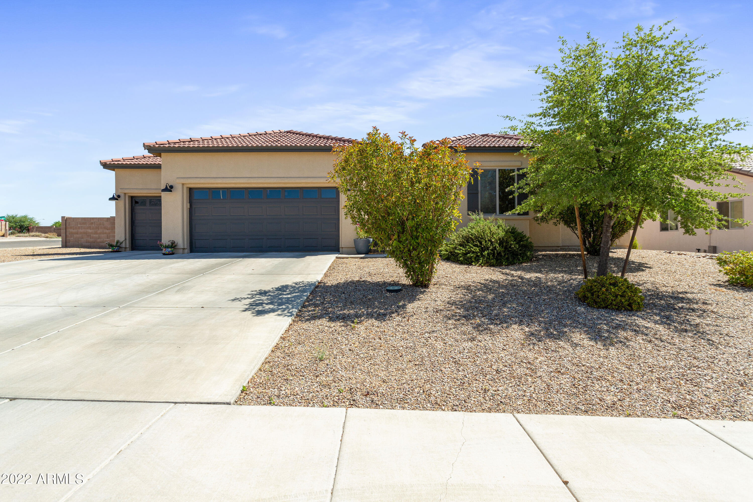 Welcome Home! This 5 bedroom 3 bath home has all the space you need. Sitting on a corner lot in the highly desired neighborhood of Coronado Crossings. Everything in this home is beautifully finished from the kitchen to the bathrooms to the tile floors throughout. Bedrooms are split floor plan style. Living, dining and kitchen are extra spacious open concept.  Exterior of home has recently been painted. Backyard has GRASS (in Arizona) Everything about this house screams HOME!