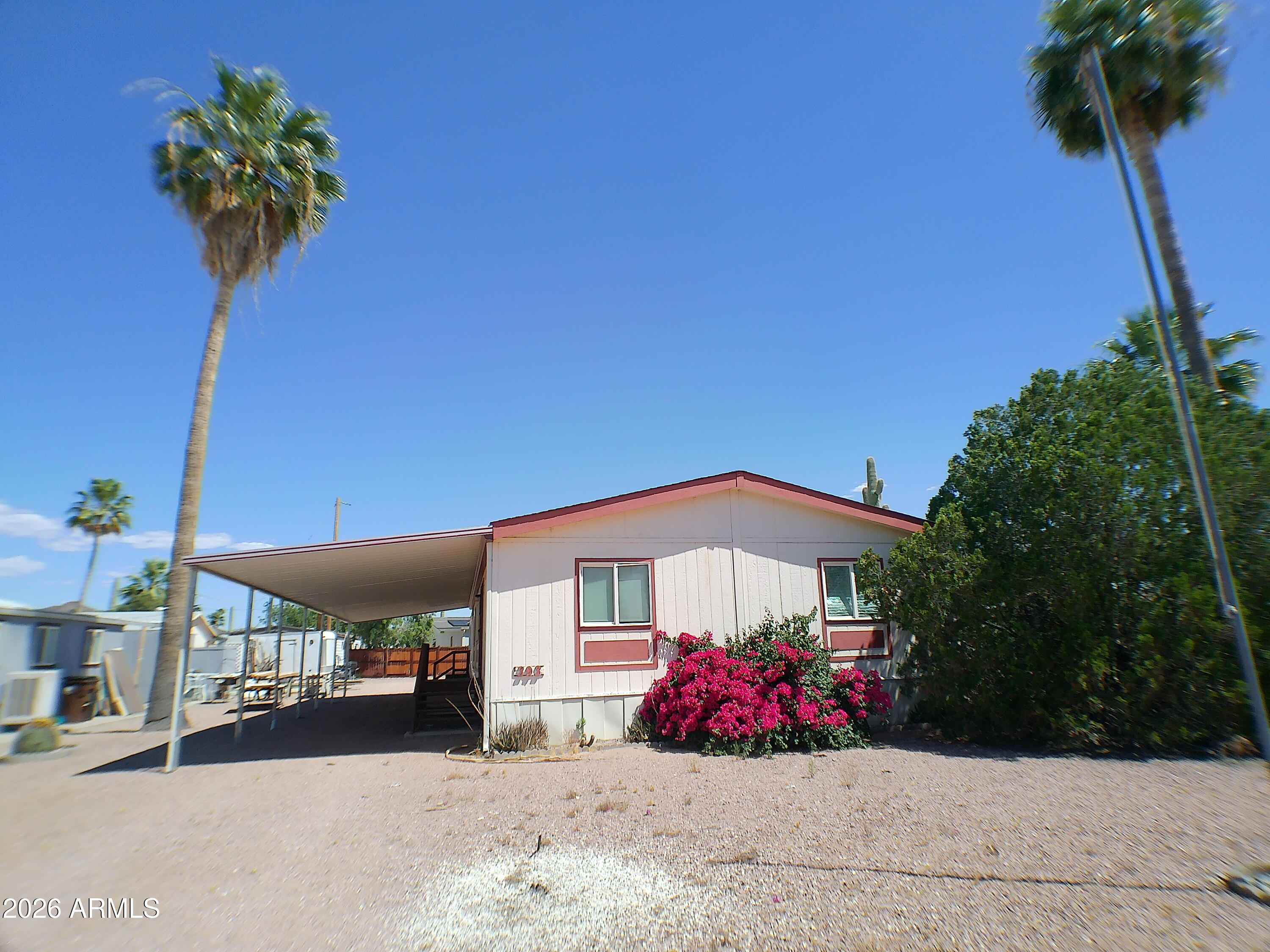 Charming 3 Bedroom 2 bathroom manufactured home with a cozy fireplace. Split floor plan includes formal dining room and eat in kitchen area. Laminate and carpet throughout.The 12 x28  enclosed Arizona Rm. has evaporated cooling. Has a 10 x 20 shed on a cement slab. Home sits in  a  cul da sac, nestled in a quiet and welcoming community. 
Golf course with memberships are available.