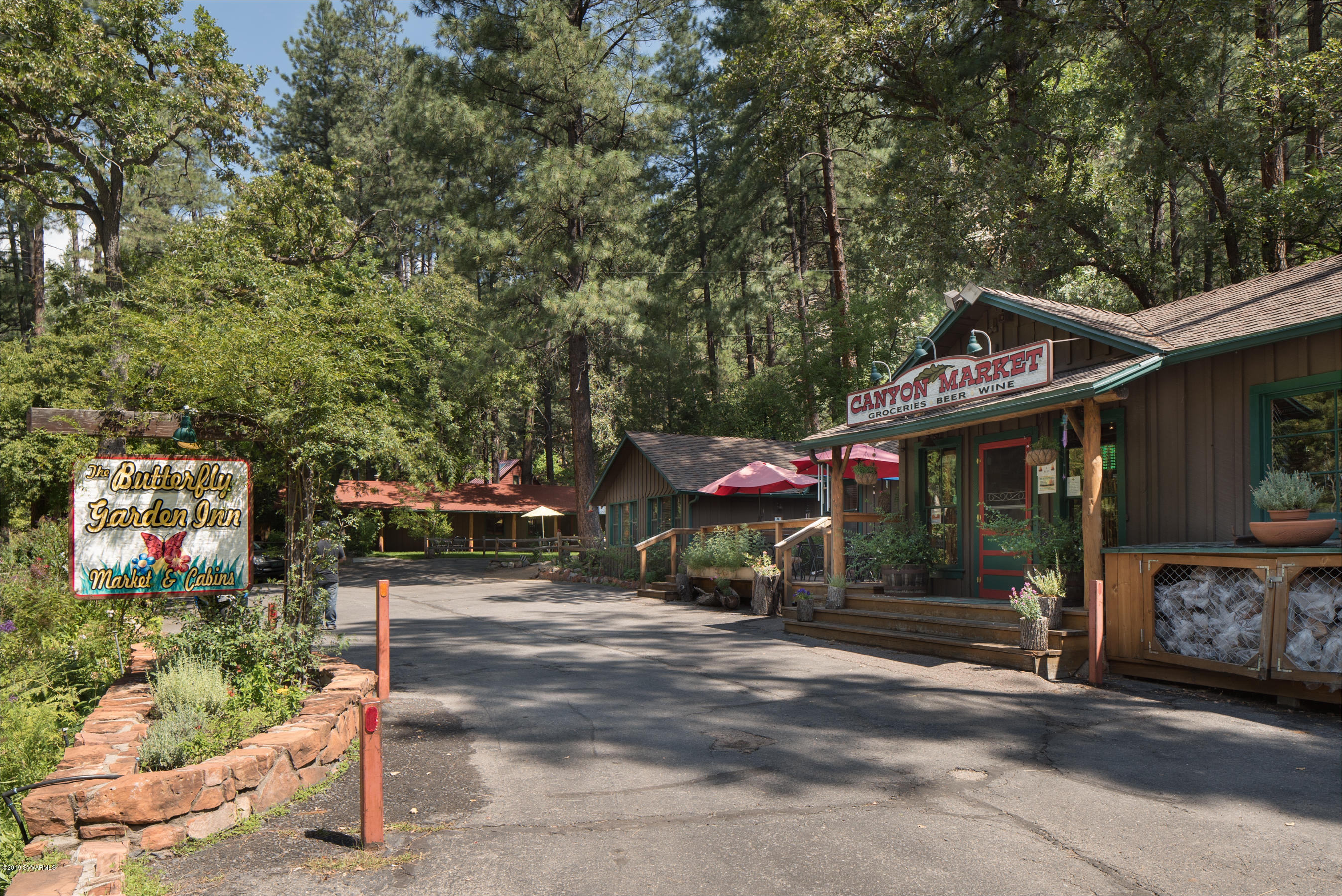 Drastic price reduction on this Historic Landmark! One Of The Last Privately Owned Large Parcels In Oak Creek Canyon. Spanning 26 Acres & Straddling 1/4 Mile Of Beautiful Oak Creek. The Picturesque Butterfly Garden Inn; ranked #2 on Trip Advisor of best places to stay in Sedona. Winner of Certificate of Excellence from Trip Advisor,  Google rating of 4.6 stars of 5. Continuing a tradition of distinction since Don Hoel's Cabins were started in the 1930's. Featuring 23 cabins, market, office, dining room & kitchen. Plans approved for 6 additional cabins. Fully renovated & rezoned to Resort/Commercial w/ nu septic system & nu underground electrical service. Ample open space w/ lawns, picnic areas. On Oak Creek & backs to National Forest. Call for your private tour today!