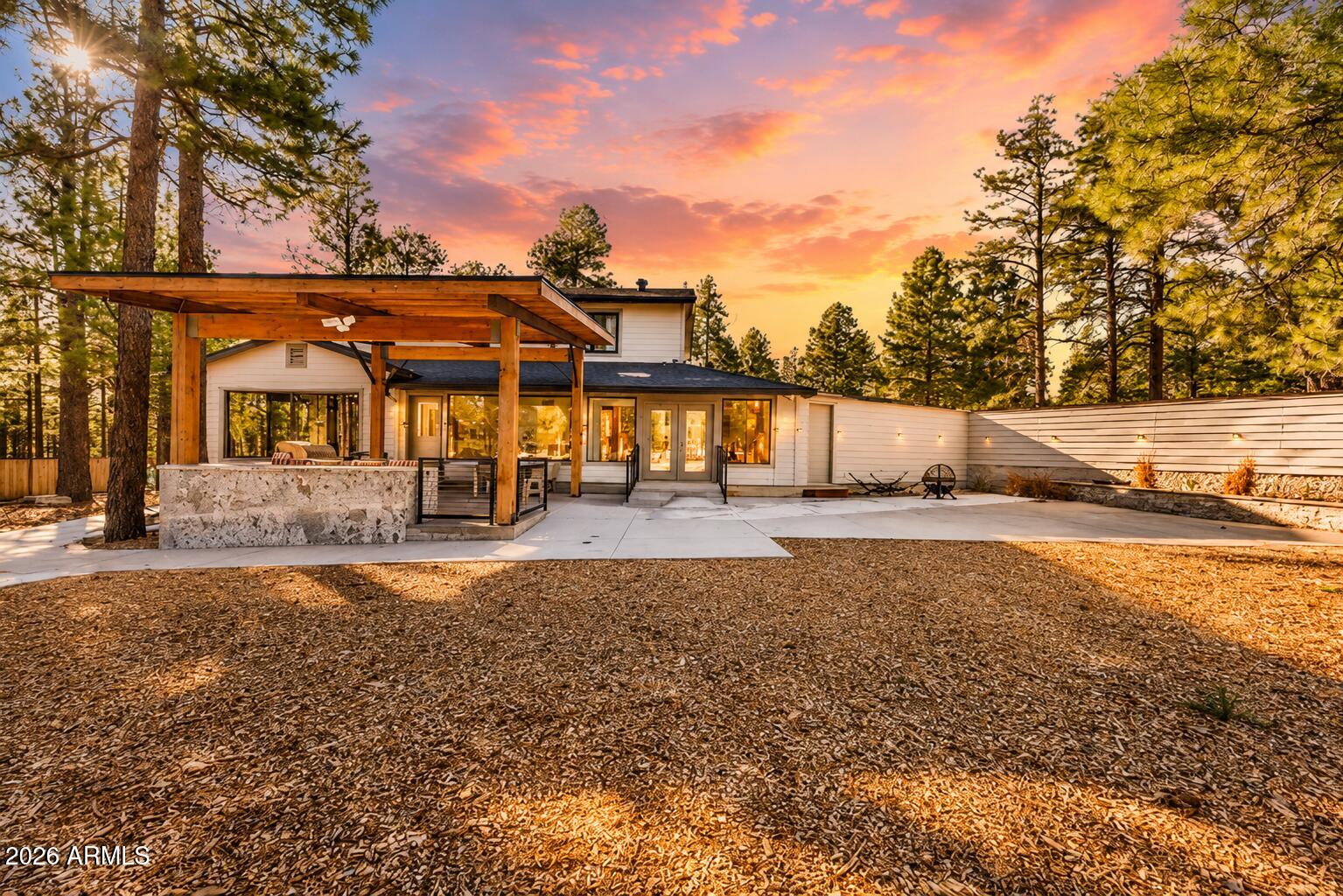 BACKS TO NATIONAL FOREST, FULLY RENOVATED, 2.25 ACRES, 6 BEDROOM ESTATE
Positioned directly against national forest land, this 2.25-acre property offers privacy, scale, and immediate access to open terrain. The two-story layout includes 6 bedrooms, 6 bathrooms, plus a dedicated office and den, designed for flexibility across multiple living needs. Interior finishes center around natural stone and wood, with a Cristallo quartzite wet bar and a granite-appointed primary suite shower adding material distinction. Expansive double-paned windows frame forest views and bring consistent natural light into the home. Major system upgrades include two new HVAC units and a new roof, supporting year-round comfort at elevation. A circular driveway creates a defined arrival and functional flow across the property. Additional upside includes the option to purchase the adjacent 2.25-acre parcel, along with approved casita plans supported by the existing 2,000-gallon septic system. Located minutes from downtown Flagstaff, Flagstaff Mall, and Arizona Snowbowl, this property combines setting, infrastructure, and expansion potential in a tightly held forest corridor.