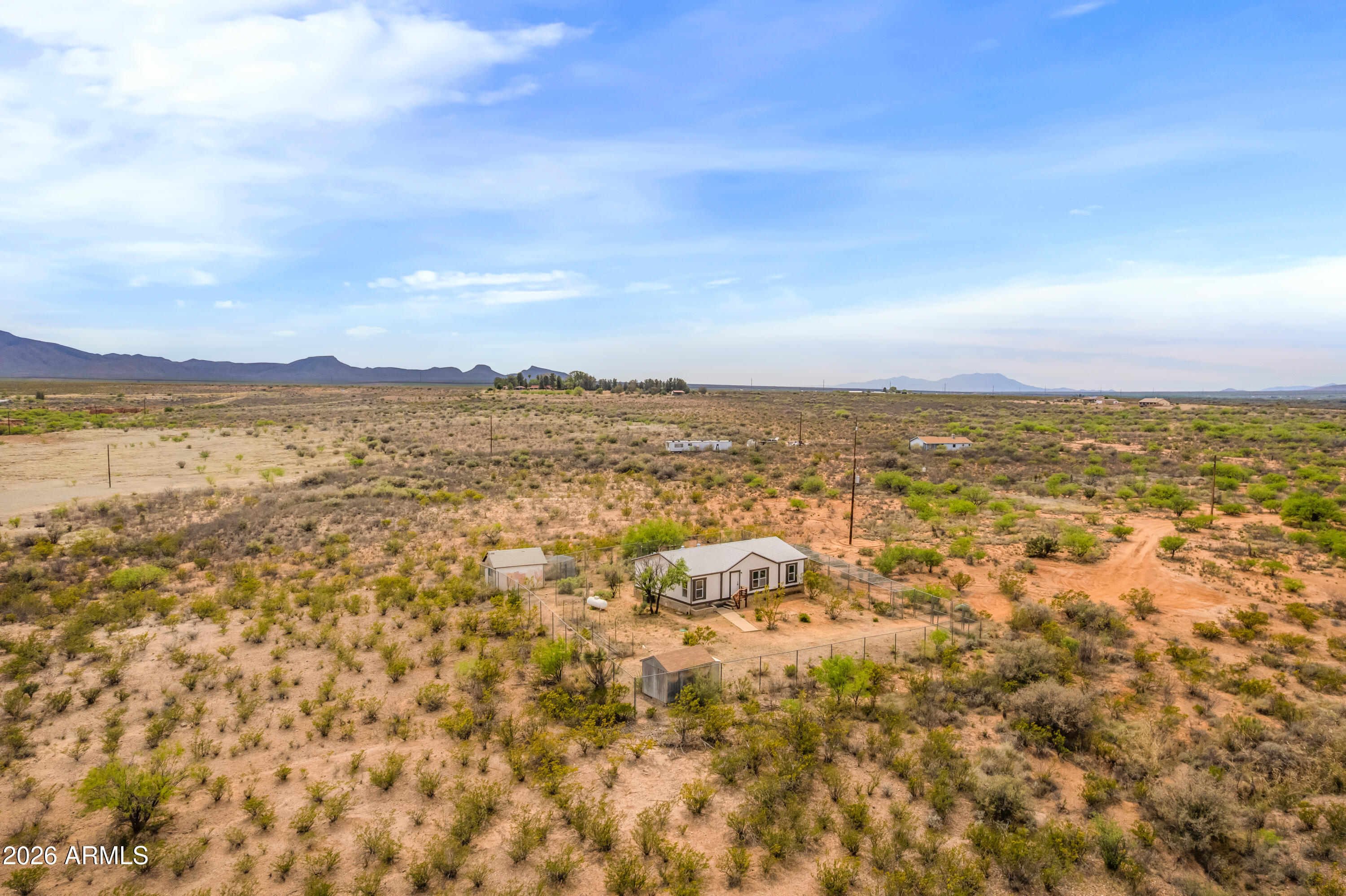 Horse property! This 3 bedroom 2 bathroom 1232 sqft manufactured home sits on 4.693 acres! Home feature a brand new roof, fresh paint inside and out,  new kitchen cabinets and appliances, new vanitys in bathrooms, new flooring, including carpet. Home was also repiped with brand new peks pipes and has a new water heater! The home is secured with an 8' chainlink fence, and also has a long dog run built in as well. There are some sheds that can be used as chicken coops. Home is remote but not to remote, 10 min from stores. Enjoy quiet sunsets and sunrises. Owner/Agent
