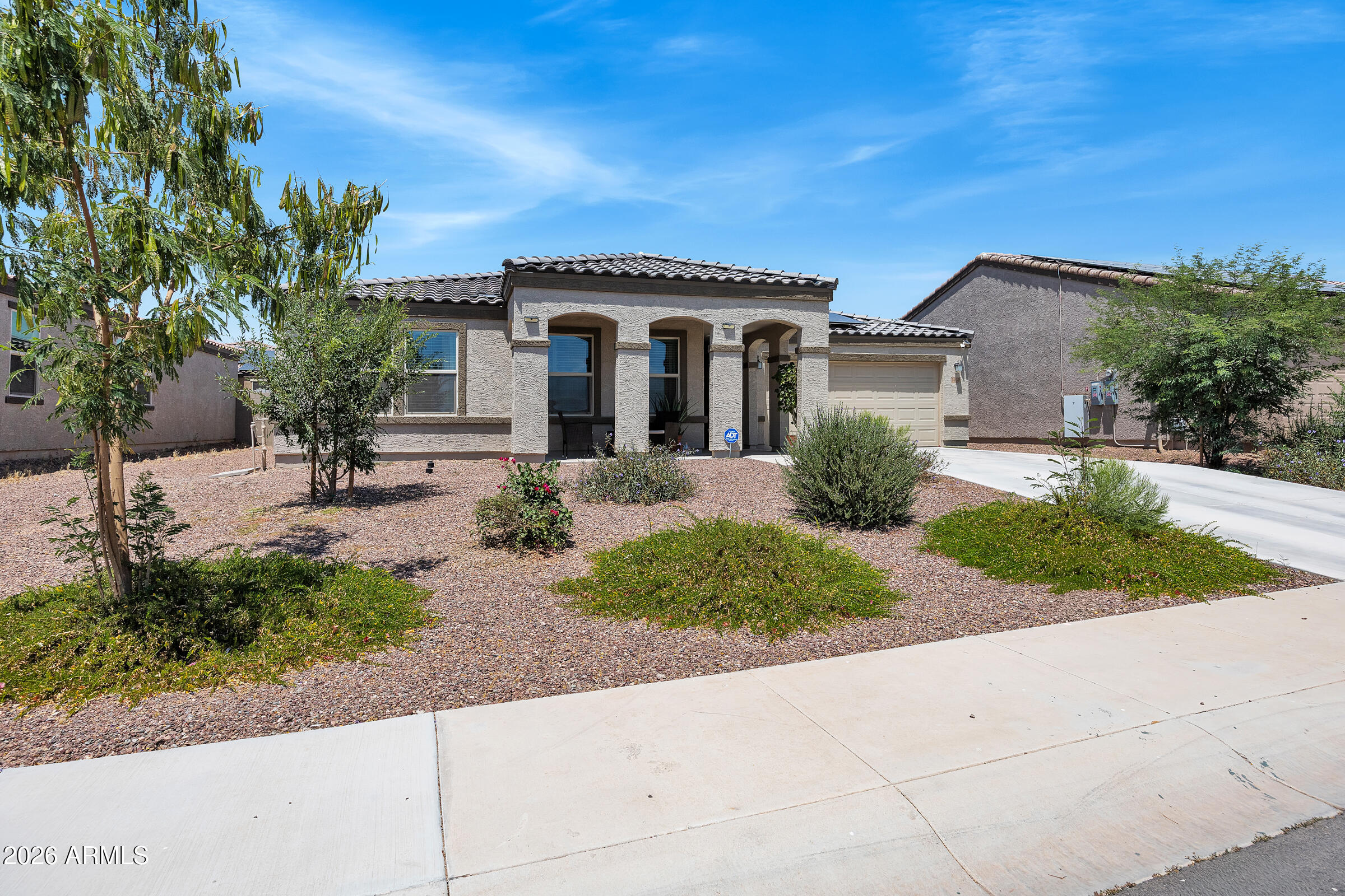 OWNED solar, a fully finished backyard - nearly $50k in upgrades make this 2023 Arroyo Vista home better than new! Located on a desirable cul-de-sac lot across from a park with no neighbors across the street, this move-in-ready 3 bed, 2 bath home offers 1,618 sq ft of stylish living space with all the extras buyers don't want to pay for after closing. Inside features granite countertops, a large kitchen island, upgraded lighting, dark cabinetry, and an open floor plan. Outside is where this home shines with extended pavers, low-maintenance turf, putting green, covered patio seating, and space to entertain year-round. Refrigerator, washer, dryer, owned water softener, RO system, and camera system all included.  Don't forget RV parking  available on the side of the home.! Yes,  TURN KEY!!