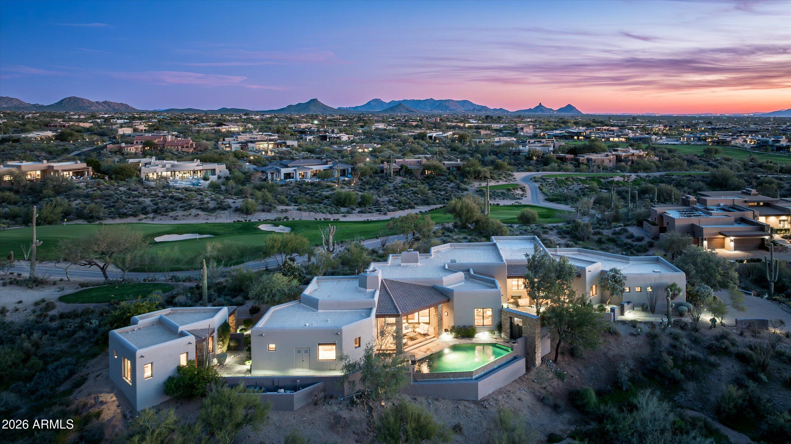 Desert Mountain Golf Membership Available. Warm Contemporary home located in Private Guard-Gated Desert Mountain Club in North Scottsdale. Designed by Tamara Pohle and built by Victor Wiger adjacent to 14th Green of Renegade Golf Course with Black Mt & Continental Mt Views just minutes from gate. Craftsmanship abounds with fine finishes & features throughout: Travertine Flooring, New Carpet, solid Alder 8' Doors & Cabinetry, Granite Countertops, Wet bar w/600+ bottle Wine Room connecting Living & Family Rooms. Casita Living room w/Kitchenette, En-suite Bedroom and Patio.  Perfect for entertaining with 3 Outdoor Patios includes Infinity Pool, Spa, Fire-pit, Fireplace, BBQ, & built-in Heaters. Home built on ridge to capture the vista's and offers privacy and a peaceful ambiance