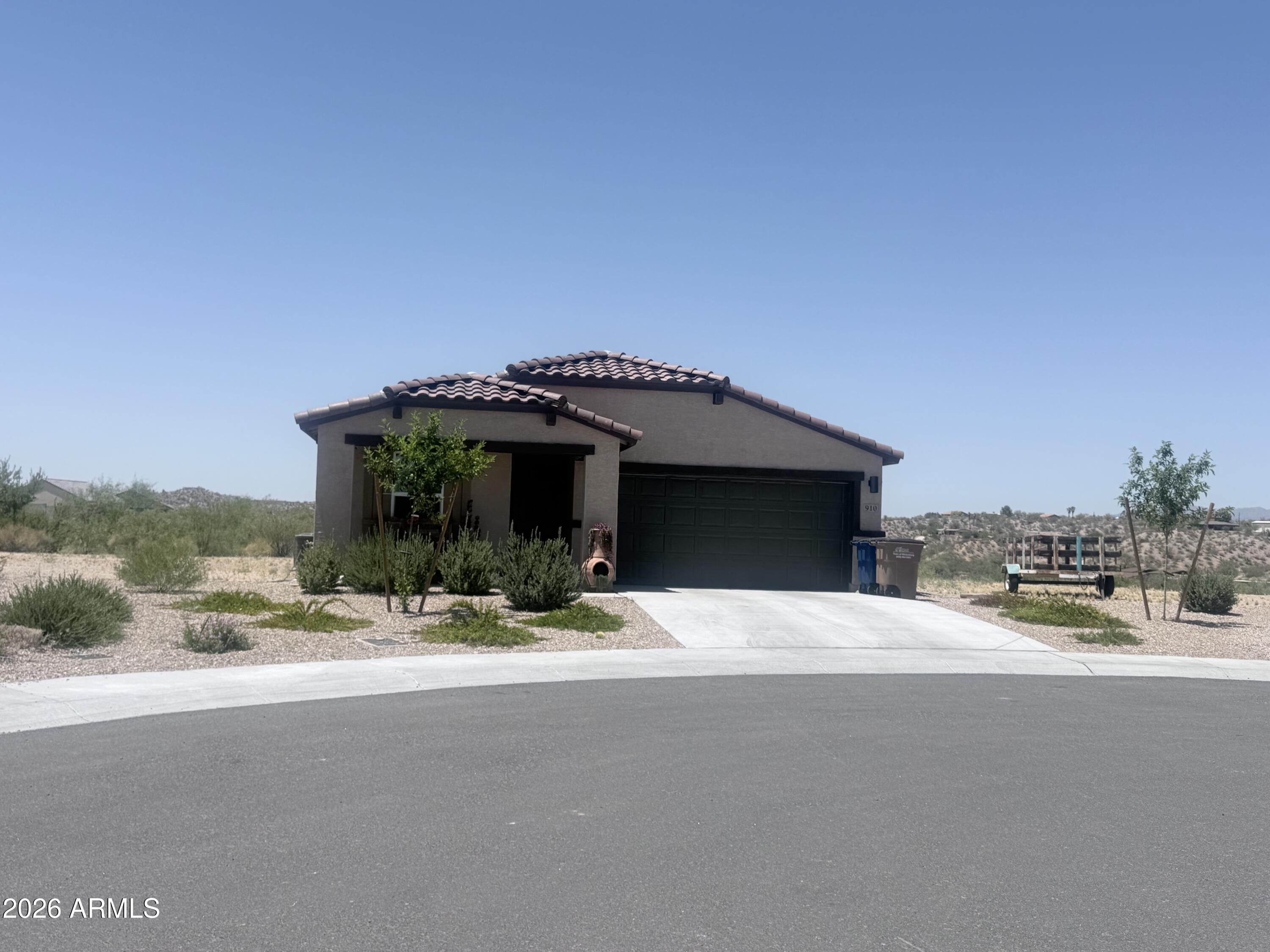 NEWER Single-Story Home in the Wickenburg Country Club Estates Community. The desirable Palmero Plan boasts an open design encompassing the living, dining, and kitchen spaces. The kitchen features gorgeous cabinets, granite countertops, and stainless-steel appliances (including range with a microwave hood and dishwasher). The primary suite has a private bath, dual vanity sinks, and a walk-in closet. This home also includes 2 more bedrooms and a  secondary full bathroom.  Block wall & view fencing to be installed., prior to close of escrow.