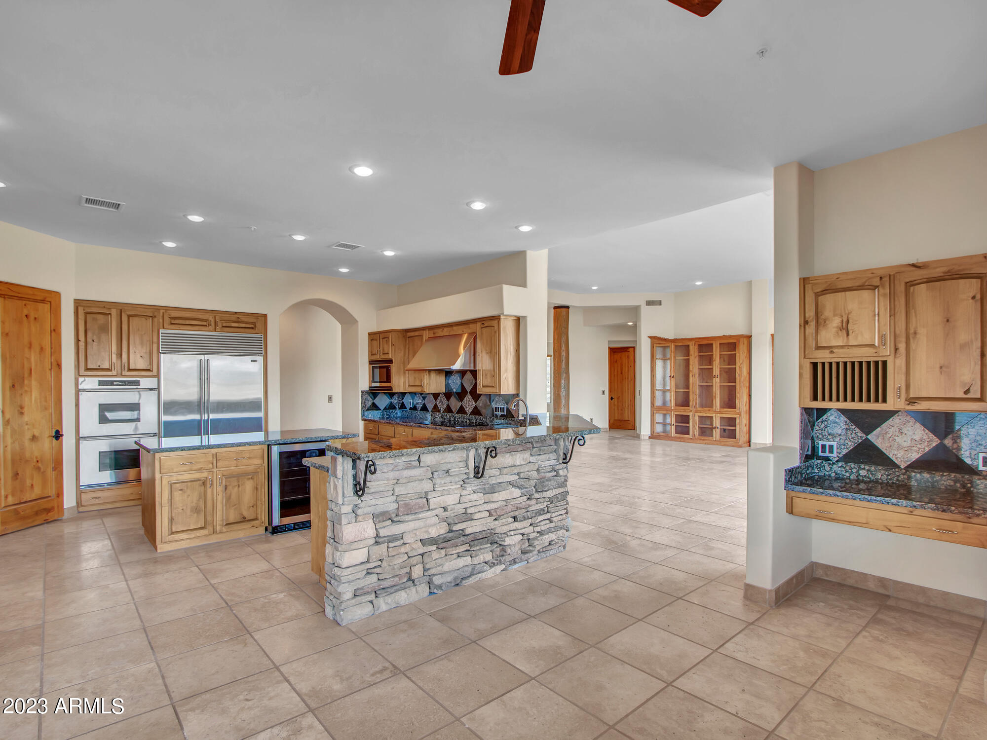 ** $50k towards Buyers' Closing & Loan Costs with Full Price Offer Acceptable to Seller ** A rare basement home opportunity in today's high build-cost market. Motivated Seller.
With 5 acres, million-dollar views, and 7,040 sq. ft. already in place, avoid the cost and delays of building new. Buy it, remodel it, and still be ahead of today's cost to build.

Positioned at the base of Cave Creek Regional Park with no HOA and horses allowed, the home features soaring ceilings, walls of glass, and a chef's kitchen with Sub-Zero and Dacor appliances. Pocket doors open to a view deck for sunset entertaining, plus a lower level with second primary suite, guest room, and great room with pool access.