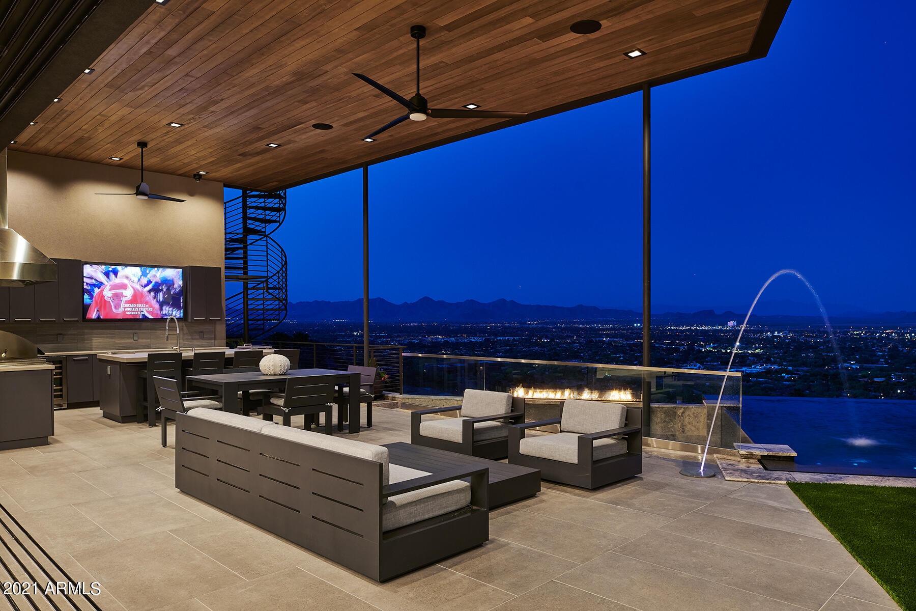 Extremely Rare opportunity to purchase a Finished Brand New Single Level Mountain Top Estate with a large flat yard, easily accessible Private Road and Gated Property with a 4 Car Garage. This Stunning One of a Kind Single Level Contemporary masterpiece is perfectly positioned at the top of Camelback Mountain created by Award Winning developer ARCO Custom Homes! The modern floorplan showcases meticulously designed open spaces with soaring ceilings, floor to ceiling windows & retractable glass walls that open to breathtaking mountain & city light views! Stately finishes & a jaw dropping entertainer's backyard featuring a large spillover spa into an infinity wet edge see through pool, firepit, outdoor kitchen and a private owner's retreat. One of PV's best locations.
