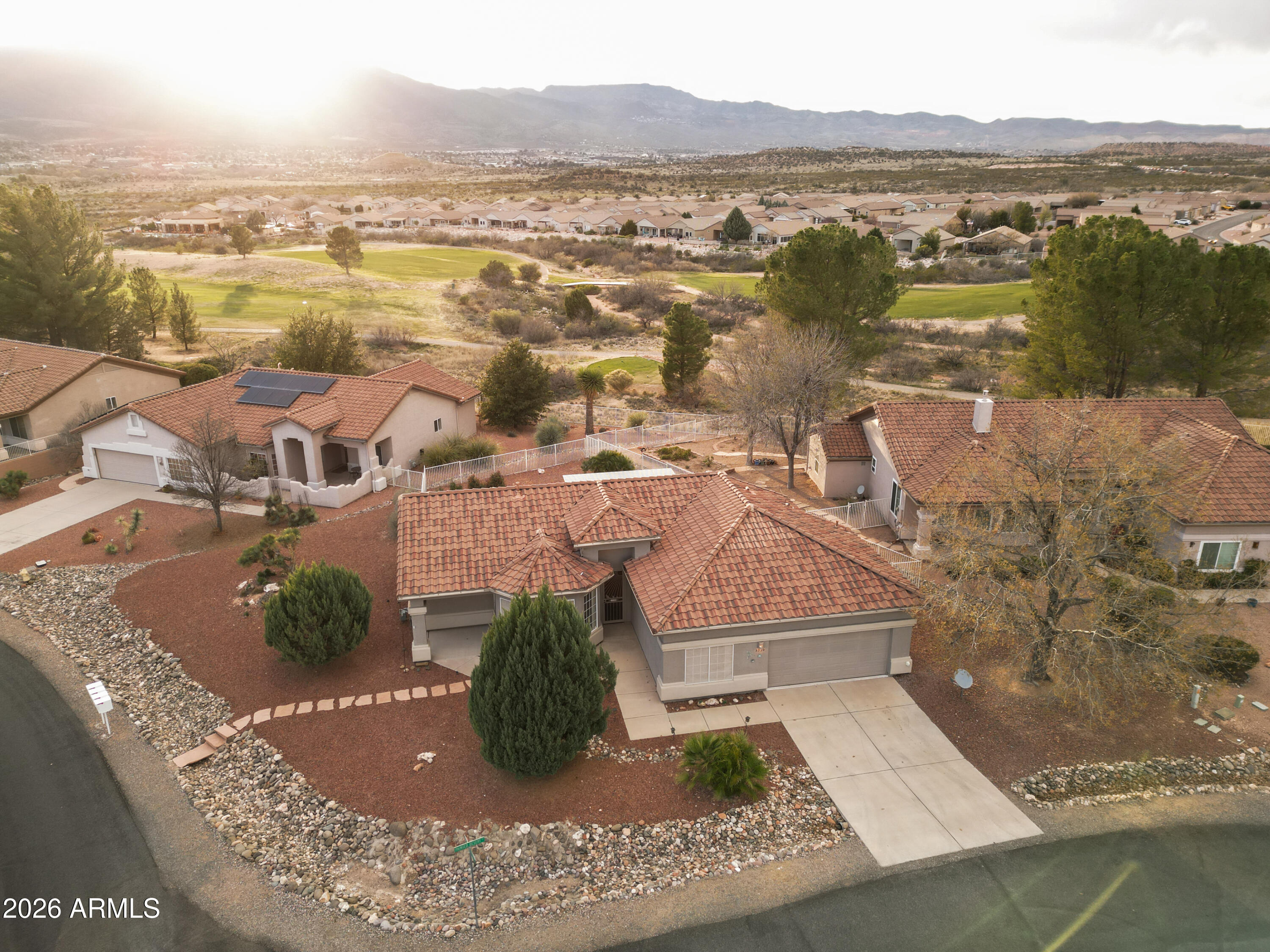 Located in the beautiful Verde Santa Fe community this house sits on a corner lot in a quiet cul de sac backed to the golf course. From inside the home and the backyard you have breath taking views of the mingus mountains and cottonwood/Jerome. Relax in your heated pool which is equipped with a new pump. Home has two bedrooms and two full baths with a bonus room that you could turn into a 3rd bedroom. Kitchen has granite countertops with stainless steel appliances. Master suite has a bay window, dual vanity, steam shower & walk in closet. Covered back patio with bbq grill that is hooked to natural gas. Beautiful front and backyard desert landscaping with areas to sit and relax in this lovely 55+ Neighborhood. Fresh Exterior paint on house and fencing and a new pool pump.
