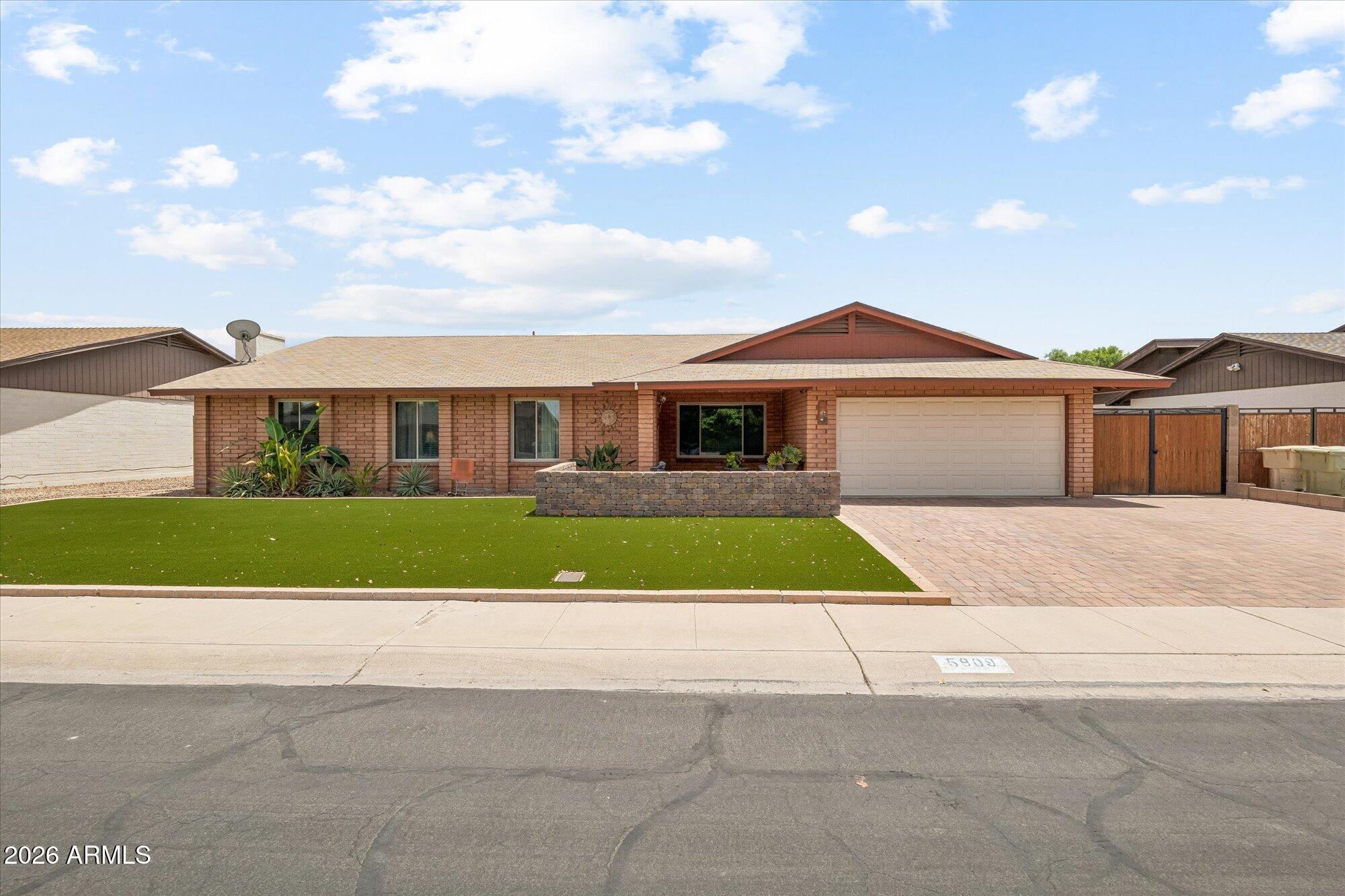 This adorable Glendale home has been thoughtfully updated inside and out. The low-maintenance front yard features artificial turf, extended paver driveway, RV gate & the sweetest front patio that's begging for a morning cup of coffee. Inside, you'll find a beautifully remodeled kitchen with custom Stone Creek cabinetry, quartz countertops & a sunny bay window in the breakfast nook. The big-ticket items are already done for you: brand-new roof, 2-year-old HVAC, 6-month-old water heater, newer RO, whole-house water softener & R-48 attic insulation to help keep those AZ utility bills in check. Out back dive into the pool, unwind in the spa, entertain on the travertine patio or enjoy the grassy area perfect for kids, pets or games. All that's left to do is move in and make it your own!