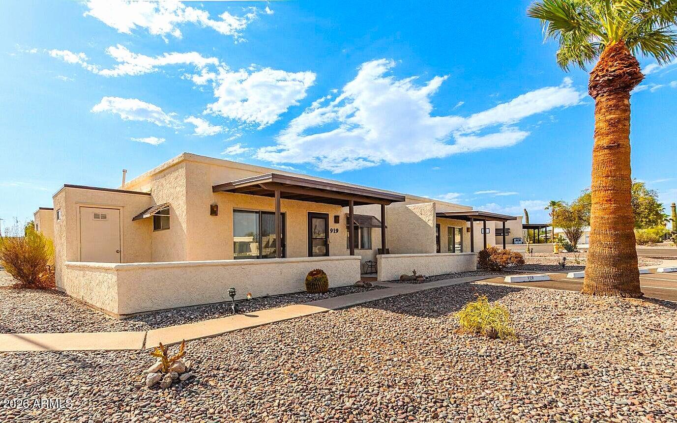 Recently updated with stylish furnishings throughout, this move-in-ready home offers a fresh, modern feel in a welcoming 55+ active adult community. Inside, enjoy tile flooring, a bright kitchen with gas range, wood cabinetry, and the rare convenience of in-unit laundry not commonly found in other units.

Relax on the inviting front porch, with added exterior storage and reserved parking just steps away. Residents enjoy Florence Gardens amenities at NO extra cost, including pools, spa, golf, pickleball, fitness center, clubhouse, and a vibrant social calendar. Perfect for full-time living or a low-maintenance getaway. Easy to show, come see it today!