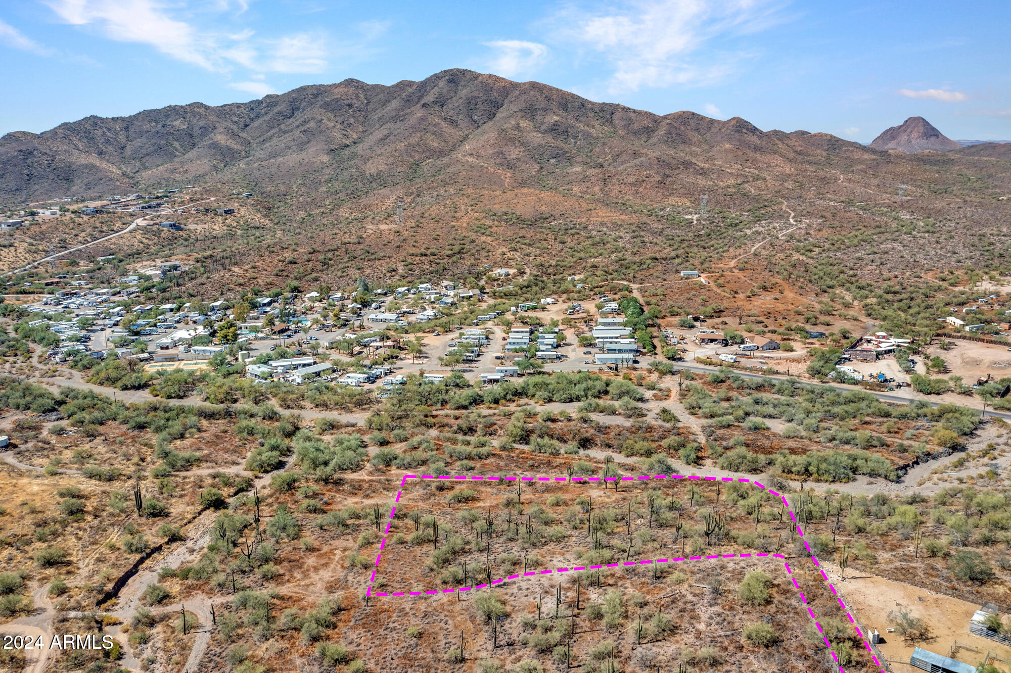 Seller Financing! Looking for a slice of desert paradise? This stunning hillside property offers incredible mountain views and over 2 acres of peace and tranquility! Tucked away in the gorgeous Sonoran Desert, this elevated lot is surrounded by beautiful, newer custom homes. Whether you're dreaming of a custom build or just want a scenic spot to call your own, this land is the perfect spot to make it happen. Imagine waking up every day to those panoramic views!