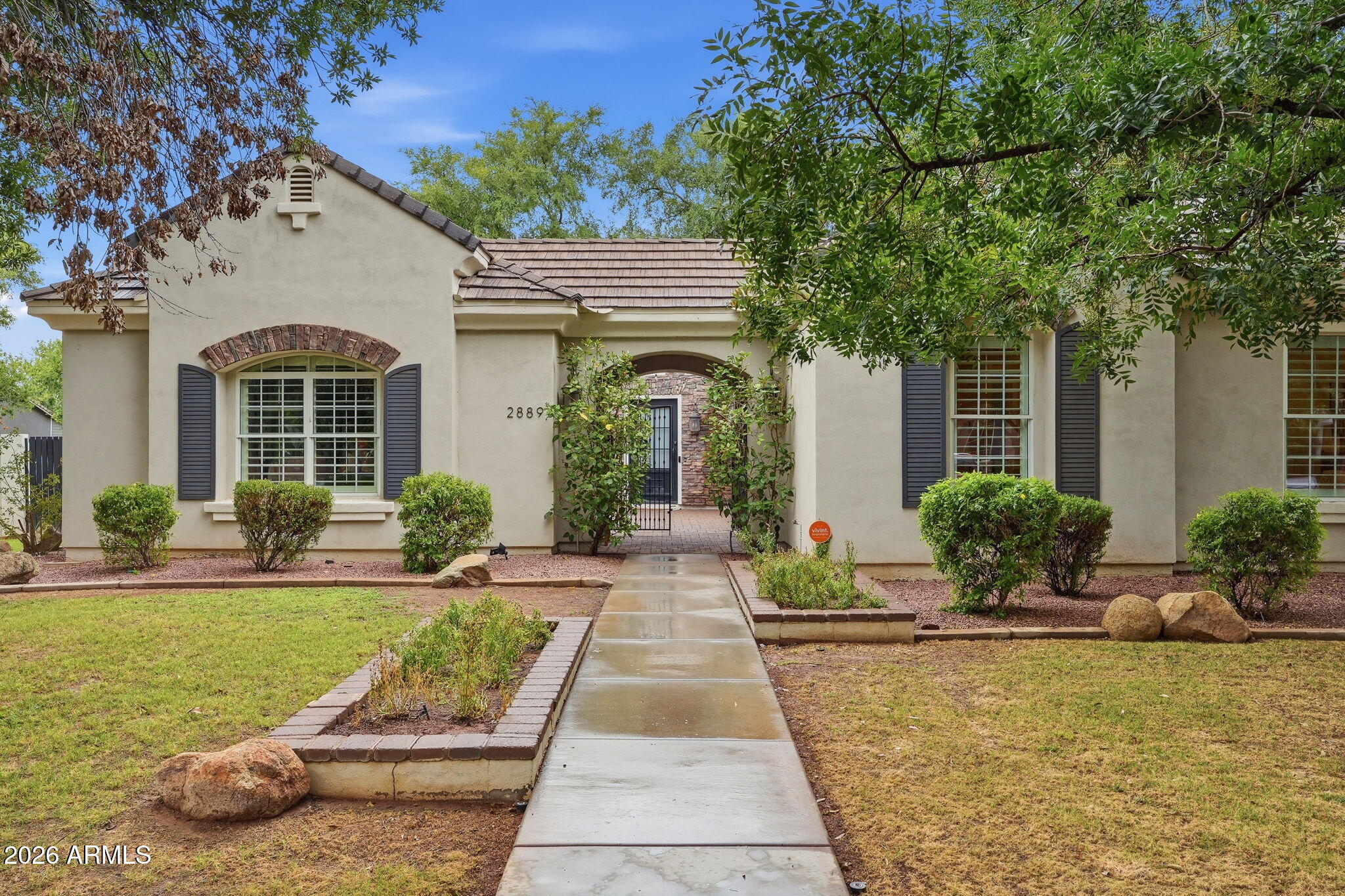 This beautiful single-story home is located in the highly desirable Morrison Ranch. It's a rare find, sitting on almost a 1/2 acre in a quiet cul-de-sac with tree-lined streets, and is one of the largest floorplans in Higley Groves West. With over 4,600 sq/ft of living space, 10' ceilings, and custom woodwork and cabinetry throughout, it has 5 bedrooms and 3.5 bathrooms in the main house, plus another bedroom and bathroom in the attached casita.

The kitchen is the central focus, with a large island, marble counters, Thermador appliances, dual dishwashers, a 6-burner gas range, dual gas ovens, a pot filler, microwave drawer, and a walk-in pantry with plenty of additional storage. Updated LED lighting and beautiful wood floors add to the home's move-in-ready feel. The home is also pre-wired for surround sound, including the game room and covered patio. Complete with its own walk-in closet, the game room offers the flexibility to serve as a 6th bedroom if needed. The attached casita has its own entrance, making it a great option for a home office or guest space. Most of the bedrooms have walk-in closets, giving you ample room for storage, and a dedicated laundry room offers a sink and counter space of its own. RO and whole-house water softener systems are already in place.

The backyard is shaded by large mature trees and also features an in-ground spa. With close proximity to the 60 and 202 freeways, shopping at San Tan Village, and only 25 minutes to the Phoenix Sky Harbor airport, this home truly has it all!