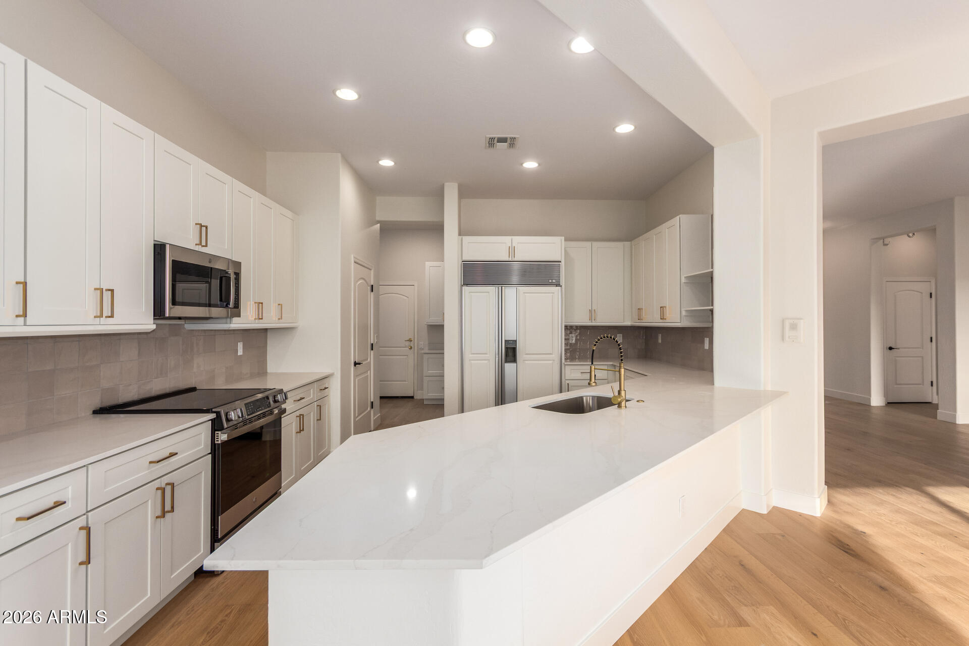 Step into this beautifully updated, move-in-ready home featuring continuous hardwood floors and a welcoming custom tile-and-hardwood entry. The remodeled kitchen includes new cabinetry, modern countertops, stainless steel appliances, and soft under-cabinet lighting -- a bright, functional space ideal for everyday cooking and entertaining.

The open family room offers a custom built-in entertainment center and an updated fireplace, creating a warm gathering area. A dedicated front office provides a bright, private workspace -- perfect for remote work or study. Guests will appreciate two refreshed bedrooms and a remodeled full bath with contemporary finishes. The primary suite serves as a true retreat, complete with hardwood flooring, a spacious walk-in closet, and a spa-like primary bath featuring a new walk-in shower and elegant, modern upgrades.

This home blends thoughtful renovations, quality finishes, and timeless style throughout -- an exceptional opportunity for buyers seeking an updated, well-maintained property.