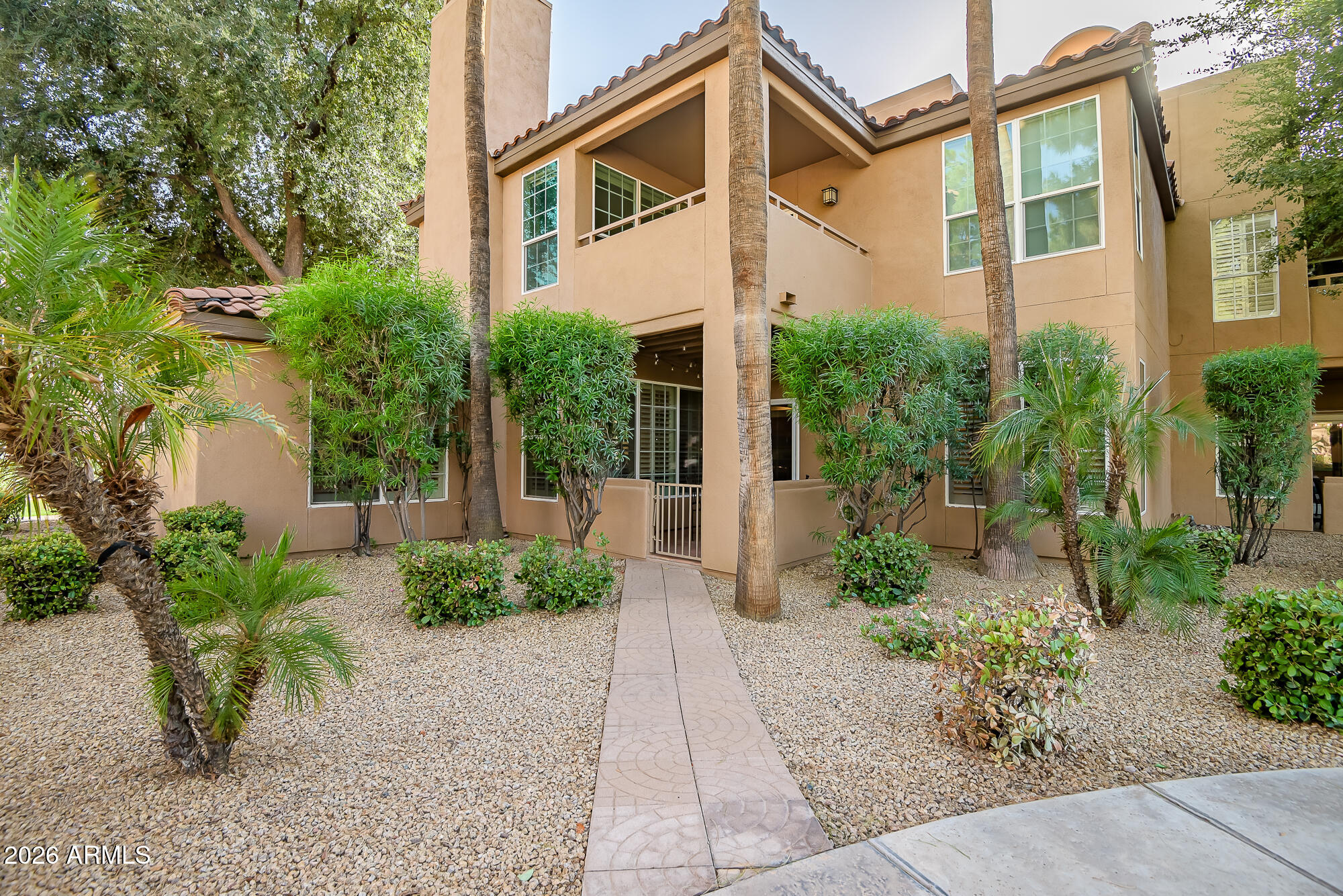Welcome to Casabella in the heart of McCormick Ranch, one of Scottsdale's most desirable communities known for its lush greenbelts, walking and biking trails, and exceptional livability. Residents enjoy beautifully maintained grounds, resort-style pools, a fitness center, tennis courts, and private GARAGEs. This charming condo is ideally located near the community pool and its private single-car garage. Features include plank flooring in the kitchen, plantation shutters, stylish ceiling fans, a cozy fireplace, and a private balcony surrounded by mature shade trees. The updated kitchen offers stainless steel appliances, recessed lighting, and ample cabinetry.  A perfect full-time home, lock-and-leave retreat, or investment opportunity.