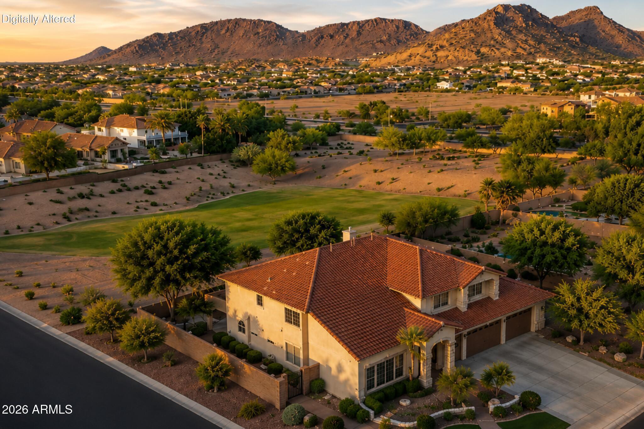 Seller Offering $10,000 Toward Buyer's Closing Costs * Downstairs Primary Suite * Oversized Enclosed Bonus Room w/ Walk-In Closet * Largest Most Flexible Floorplan in the Community * Premium Corner Lot Backing Greenbelt * No Neighbors Behind * Unobstructed Mountain Views * Newer Roof and HVAC Systems * Heated Pool, Waterfall, Built-In BBQ, and Sunken Fire Pit Area. 
-----Rarely available, this spacious 6-bedroom, 3.5-bath home offers 4,633 square feet of thoughtfully planned living space in one of North Peoria's most desirable gated communities. Whether you're looking for room to spread out, accommodate multiple generations, work from home, or entertain on a larger scale, this floor plan provides the flexibility to adapt to a variety of lifestyles. Natural light, expansive living areas, and seamless indoor-outdoor flow create an inviting atmosphere throughout the home. From everyday living to holiday gatherings and weekend entertaining, the layout was built to bring people together while still providing the privacy and separation today's buyers appreciate.
Outside, the backyard serves as a private retreat where mountain views, open skies, and resort-style amenities create the perfect setting for relaxing, entertaining, and enjoying Arizona living year-round. Complete with a 4-car garage, RV gate, and convenient access to shopping, dining, Loop 101, Loop 303, and Lake Pleasant, this home offers a lifestyle that is difficult to replicate within the community.