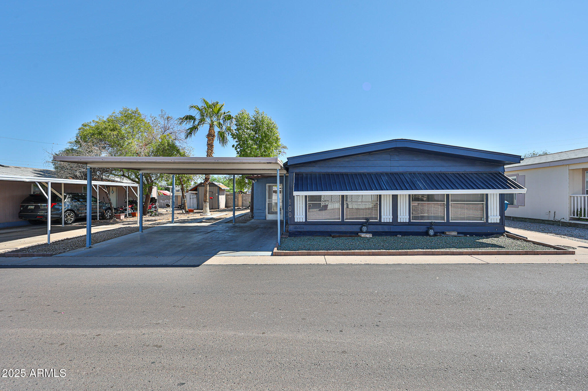 Family Friendly community! Double-wide Manufactured home. Freshly painted outside 2025. Ceiling fans with light installed 2023 in every room. Tyle floor though out the manufactured home installed 2022. Kitchen remodel 2022 with counter quartz, built in microwave, bathrooms remodel 2023, New blinds in windows, Arizona room tile and remodel 2021. Space to convert a 3rd bedroom. Space to park a 3rd car. This community is close to gyms, restaurants, shopping, and schools. It also offers a Large Rec Center with a community pool. It's a must-see!