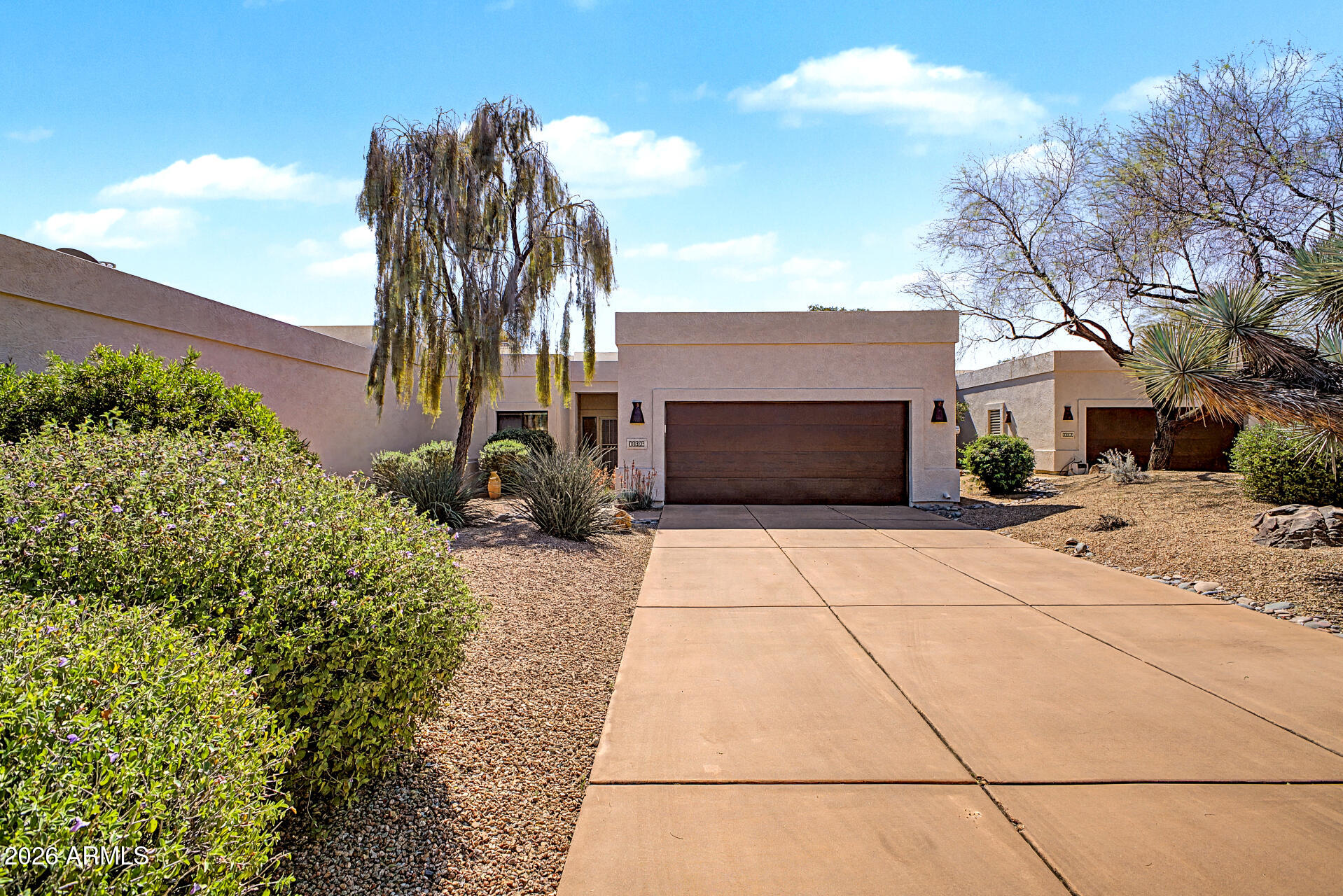 FULLY FURNISHED TURN KEY A beautiful 2 bed, 2 bath townhome in Tonto Verde is now for sale! Charming curb appeal, a low care landscape, and a 2 car garage w/built-in cabinets are just the beginning! Inside you will find a spacious semi-open concept w/high ceilings, durable tile flooring & soft carpet in all the right places, custom palette throughout, and a fireplace to keep you warm & cozy. The kitchen is equipped w/everything you'll need for home cooking, ample cabinet & counter space, recessed lighting, and stainless steel appliances. Double doors open up to the primary suite, boasting a private bath w/dual sinks and a walk-in closet for all your belongings. Also including a quaint backyard covered patio, this home is sure to be the one for you! Act now before it's gone!
