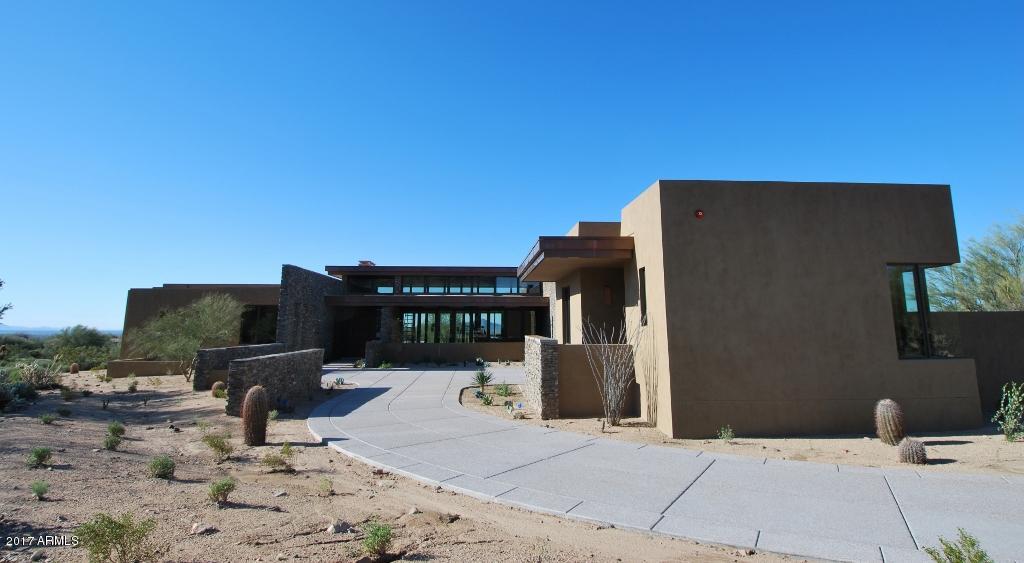 New custom home in DC Ranch!  This 7060 sq ft soft contemporary design by Erik Peterson/Phx Architecture is located on one of the top sites in all of DC Ranch.  At over 1 acre, this south-facing property looks over the 17th green and is framed by the McDowell Mountains and the sweeping vistas of the Valley below. Home is being built by Sonora West Development, one of the most active builders in the DC Ranch/Silverleaf neighborhood.  This hard to find one level home has 4 bedrooms plus guest casita and den,  4.5 bathrooms, open great room/kitchen,  3 car garage, and generous outdoor living spaces overlooking the pool and city view.  This design features walls of glass on both sides of home to bring in maximum light and pocket doors in four rooms to bring the outdoors in. outdoors in.  This rare combination of design style, main-level living, city views, cul-de-sac privacy, southern exposure, and golf frontage make this a must see for any buyer who appreciates the very best.