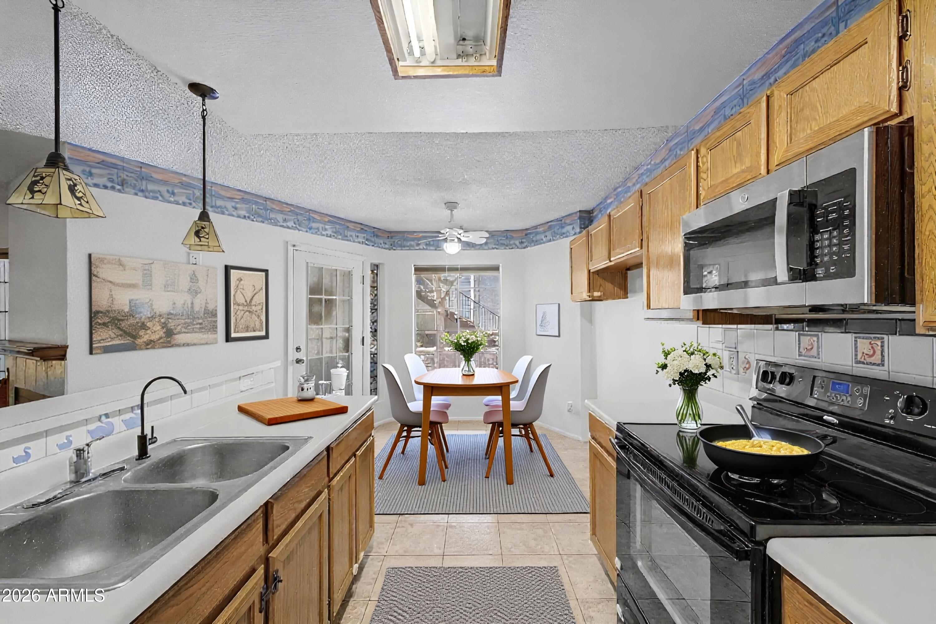 Discover this delightful 2-bedroom 2-bath condo with a desirable location close to shopping, parks, and freeways! Inside, you'll find sizable living spaces designed with comfort in mind, featuring tile flooring, a neutral palette, and a fireplace to ensure cozy winter evenings. The kitchen comes equipped with oak cabinetry, tile backsplash, spacious counters, and built-in appliances for a seamless cooking experience. Relax after a long day in the primary bedroom, including a private bathroom for extra comfort. Enjoy your morning coffee under the covered patio, and don't forget to visit the community's pool, spa, walking path, and other amenities for fun times! Check it out before it's gone!