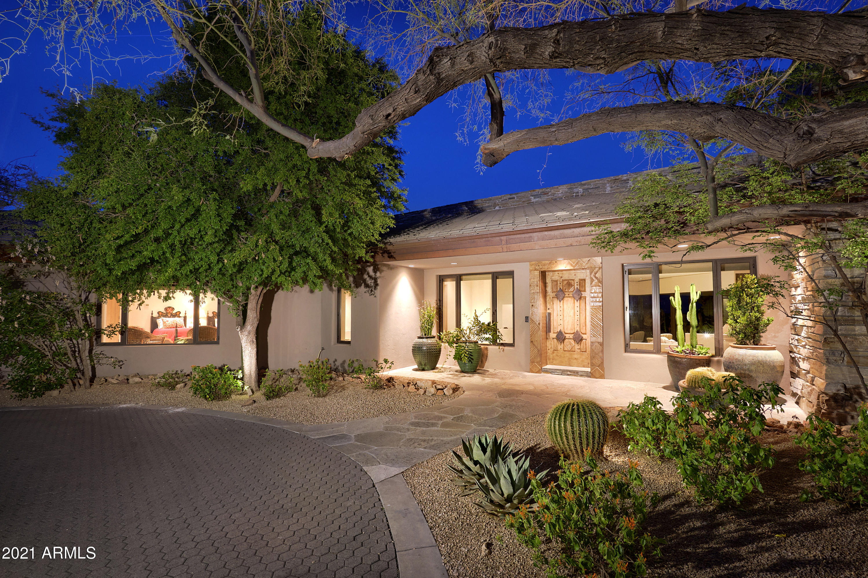 This artfully crafted 5,050 sq ft home with a 1,370 sq ft guest house sits on 2.5 acres and has a 3 car garage, pool, spa and waterfall with a flowing river.  It offers a master chefs kitchen with granite counter tops and butlers pantry.  Glass windows and doors from floor to ceiling which presents magnificent views of the famous Boulders resort and two golf courses and incredible city light views.  Guest house has a bedroom, living room, kitchen, fireplace and quartz floors.  The home has all the smart wiring plus powered draperies & blinds and pool side BBQ.  If you are looking for a home with all the features you would desire plus endless views, you have just found it and no more need to keep looking.