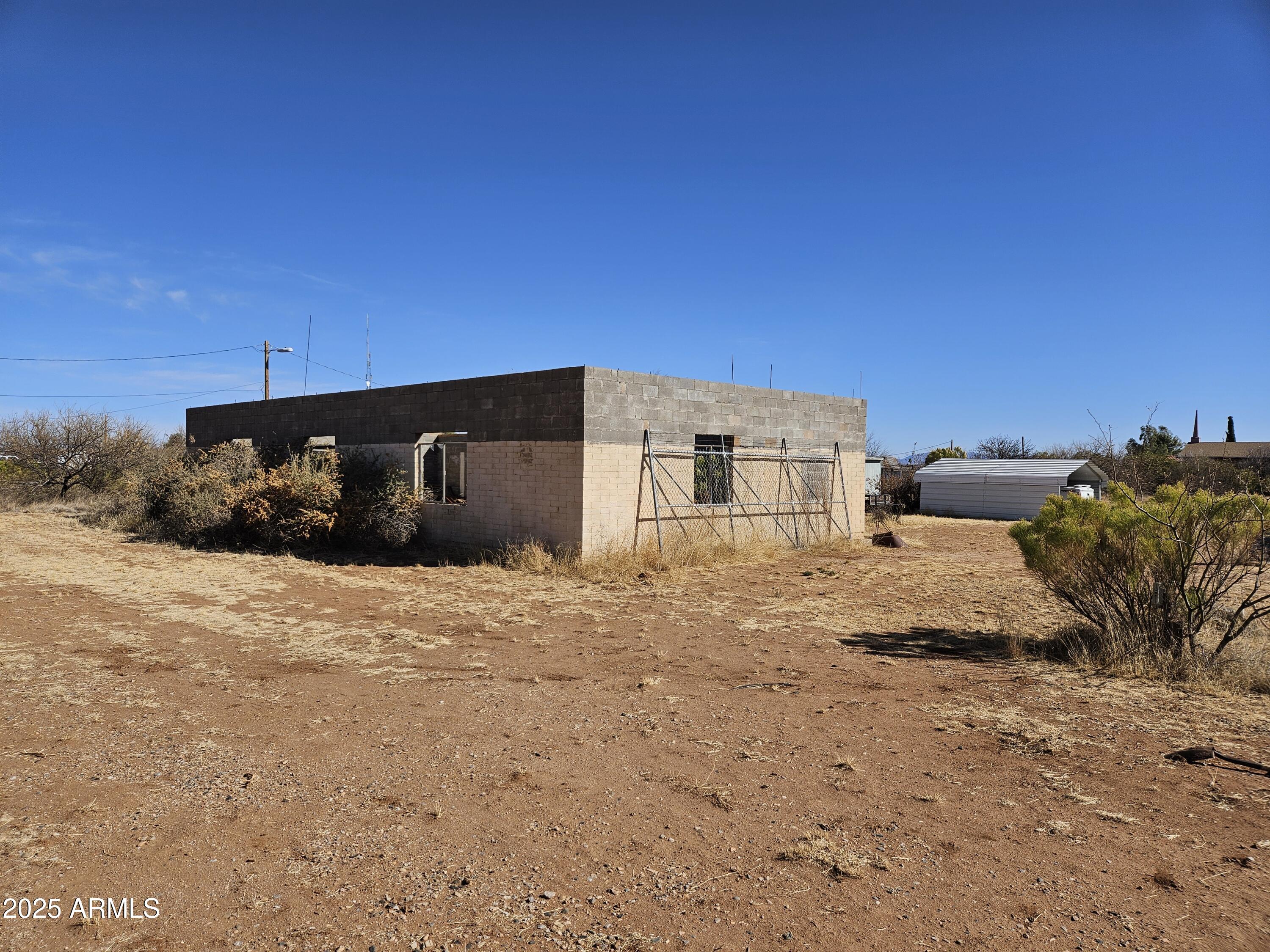Corner Commercial Property 2.37 Acres with block shell building, & include 2 Mobile homes. 2 septic and a well. Owner may carry. At 10% with 25% down with a 5yr balloon.