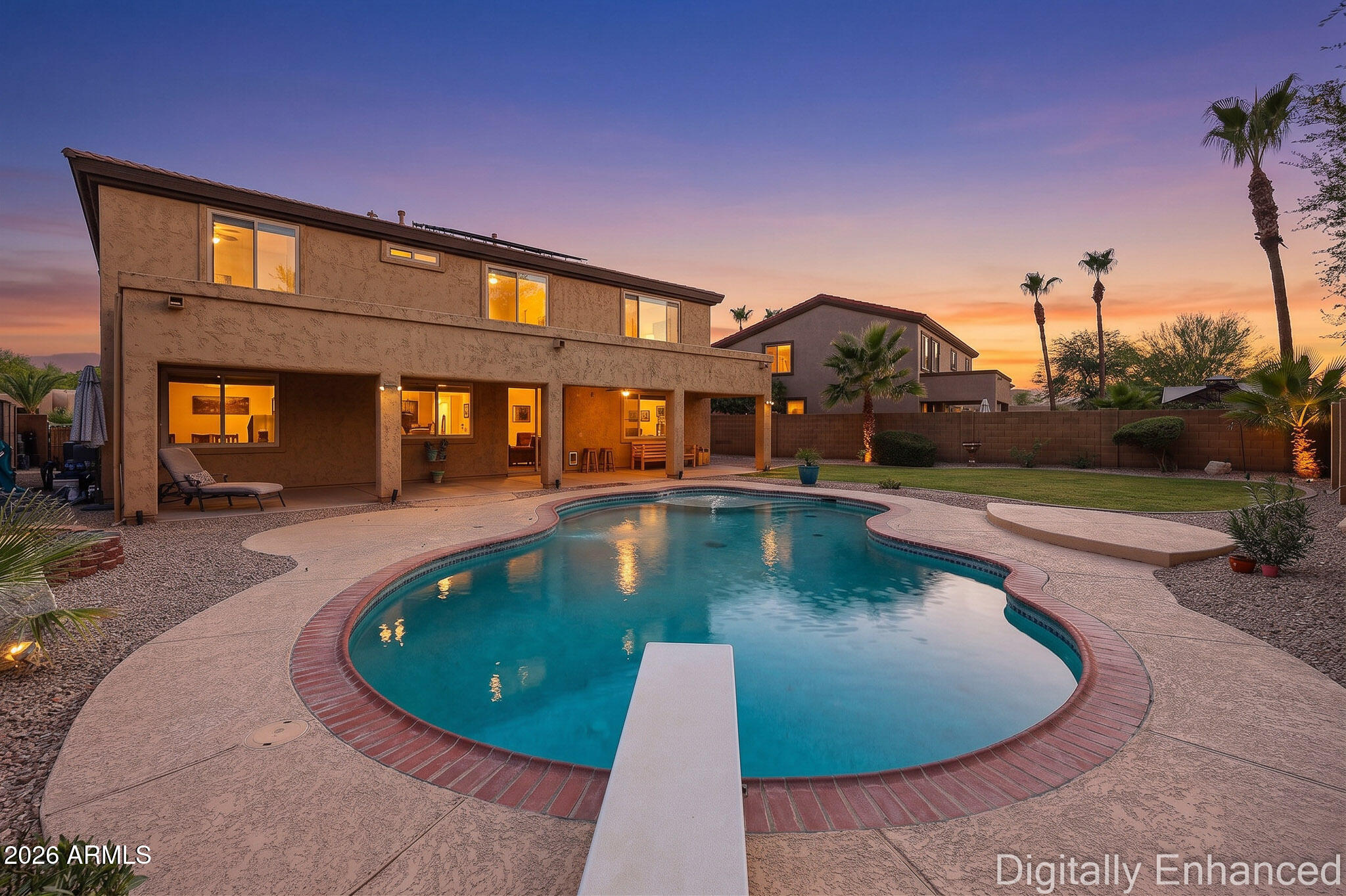 Meticulously kept home near old town Litchfield Park. 5 bedroom + Flex room,  3 full bath with OWNED SOLAR and Sparklingly Dive Pool!! Oversized lot in cul de Sac and no neighbors behind! Have I got your attention yet?!? Well theres more! Step inside this beauty and your greeted by soaring ceilings with wood staircase in the grand foyer! Spacious Formal living and dining room with built in Bar/Buffet allows for plenty of room for everyone to gather for any festivity. Downstairs you will also find a Flex room, currently used as an office space with built in desk and cabinets. Perfect for work at home, home school or easy convert to guest bedroom. Wait till you see the ''heart of the home!'' This kitchen boasts tons of cabinets and ample counter space, island w/ storage, gas stove, microwave desk area, and the picture window over the sink faces the sparking pool! Family room is just off the kitchen with cozy gas fireplace. Dedicated laundry-room with cabinets. Upstairs you will find grand double door entrance to the owners suit with a spa like bath. Separate vanities, deep garden tub, walk in shower and large walk in closet. Also upstairs is 4 other bedrooms with full bath, double sinks that are separated from a shower/private toilet room. Outback you will discover a full length patio, sparkling 8.5ft diving pool and large grass area, activities are endless!! RV gate has extended driveway for additional parking. All this with energy efficiency! 27 solar panels / 9.585 kW -- HVAC systems replaced in 2020, Gas Water heater, and most of the windows have recently been replaced.