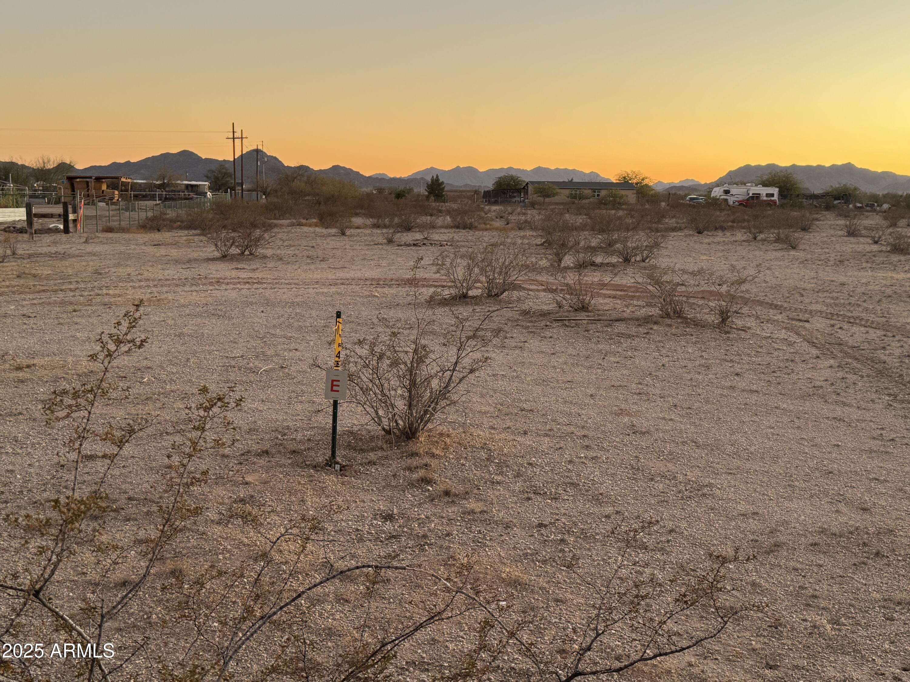 APPRX CENTER OF PARCEL HERE 33.243017, -112.469062
ENTER FROM ALAMO RD, NOT MANZANILLA.  LARGE 2.25 ACRE PARCEL! ELECTRICITY APPROX 315' EAST!! GRAVELED ROAD FROM ALAMO RD ALONG THE SOUTH PROPERTY LINE.  LEVEL LAND.  NO FLOOD ZONE. POPULAR LOCATION IN RANBOW VALLEY RANCH 2, IN UNINCORPORATED MARICOPA COUNTY WITH BUCKEYE ADDRESS.  SITE-BUILT AND MANUFACTURED HOMES OK HERE. OUTSTANDING MOUNTAIN VIEWS. AREA NEAR FUTURE 303 LOOP, I-11 AND THE SOUTHTERN PART OF ESTRELLA MOUNTAIN RANCH.  SELLER WILL CARRY. REACH OUT FOR CARRYBACK TERMS. DON'T MISS THIS GREAT OPPORTUNITY BEFORE IT'S GONE.  PARCEL A OF THE SURVEY.