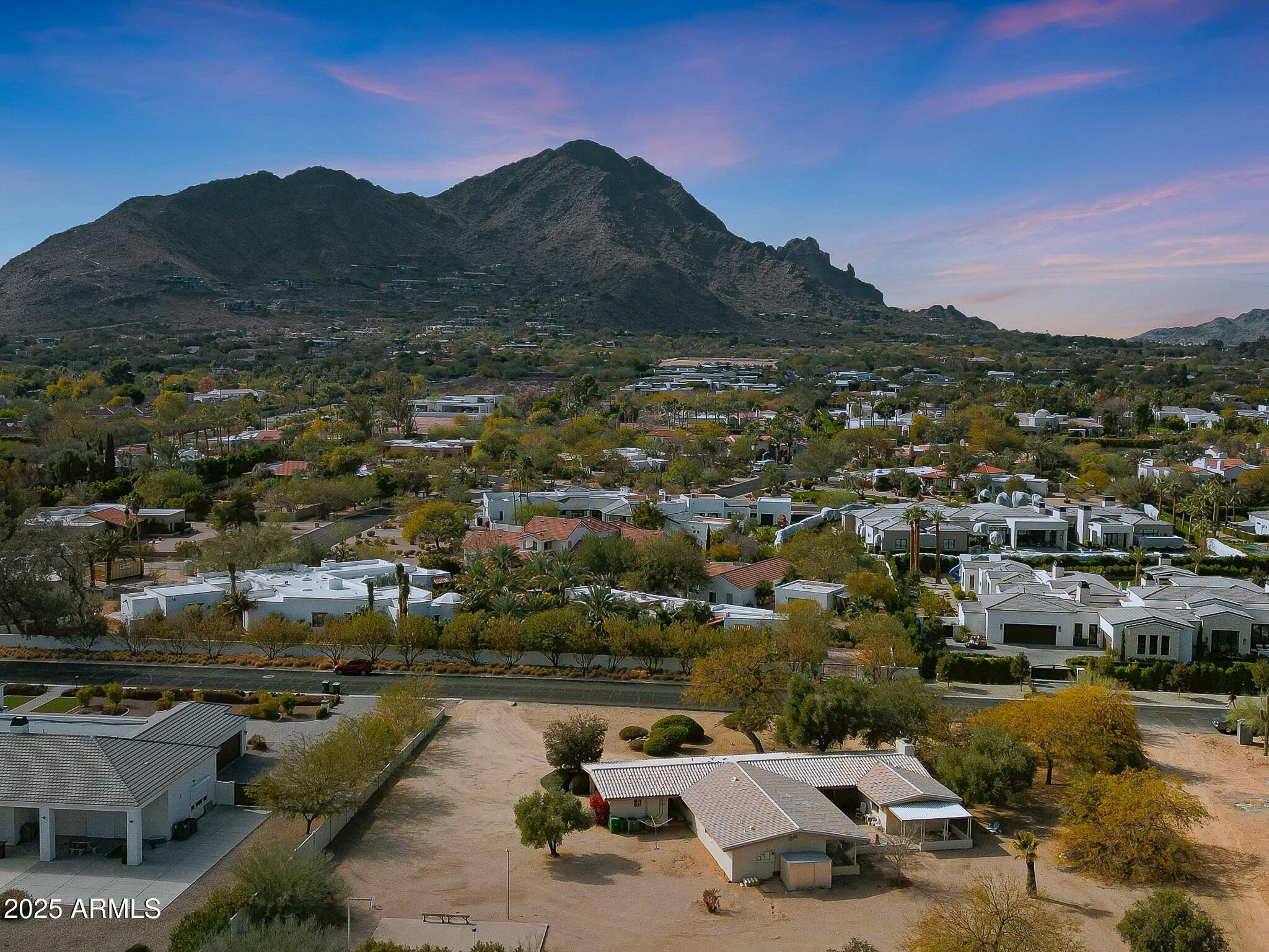 This 1 acre lot in Paradise Valley is ready for you! With wonderful views of Camelback Mountain and it's prime location near schools, shopping, resorts, & restaurants it's all you could ask for! The lot is flat and ready for an easy build or you can make the current ranch home your own with some updates. The possibilities are endless!