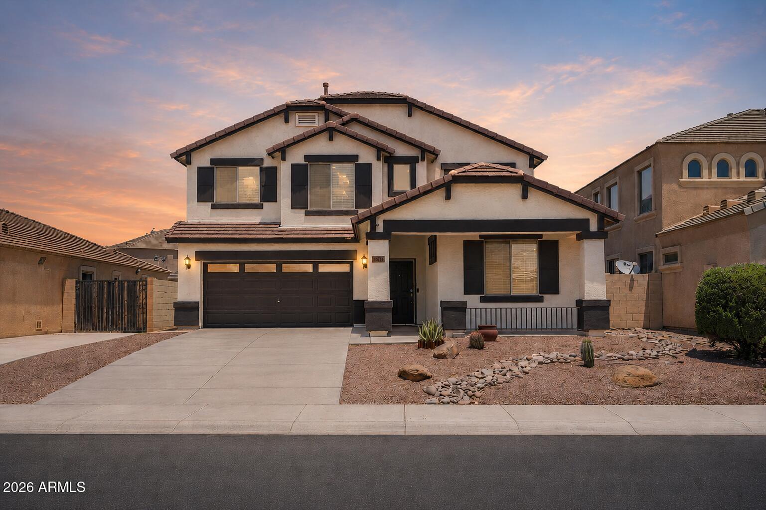 Solar lease is being PAID OFF at close. Zero payment. Just savings starting day one. This Goodyear home is move-in ready and packed with updates that actually matter. New interior paint, new fixtures throughout, upstairs AC replaced in 2022, and a backyard built for Arizona living with a covered patio, newly installed artificial turf, updated landscaping, and an irrigation system. Inside you get vaulted ceilings, tile flooring, a main-level bedroom and full bath, and a kitchen with a center island, gas range, and abundant cabinet space that opens right into the family room. The primary suite has a large walk-in closet, dual sinks, and a walk-in shower. Secondary bedrooms are spacious and flexible. Top-rated schools, parks, trails, shopping, dining, and freeway access all nearby.