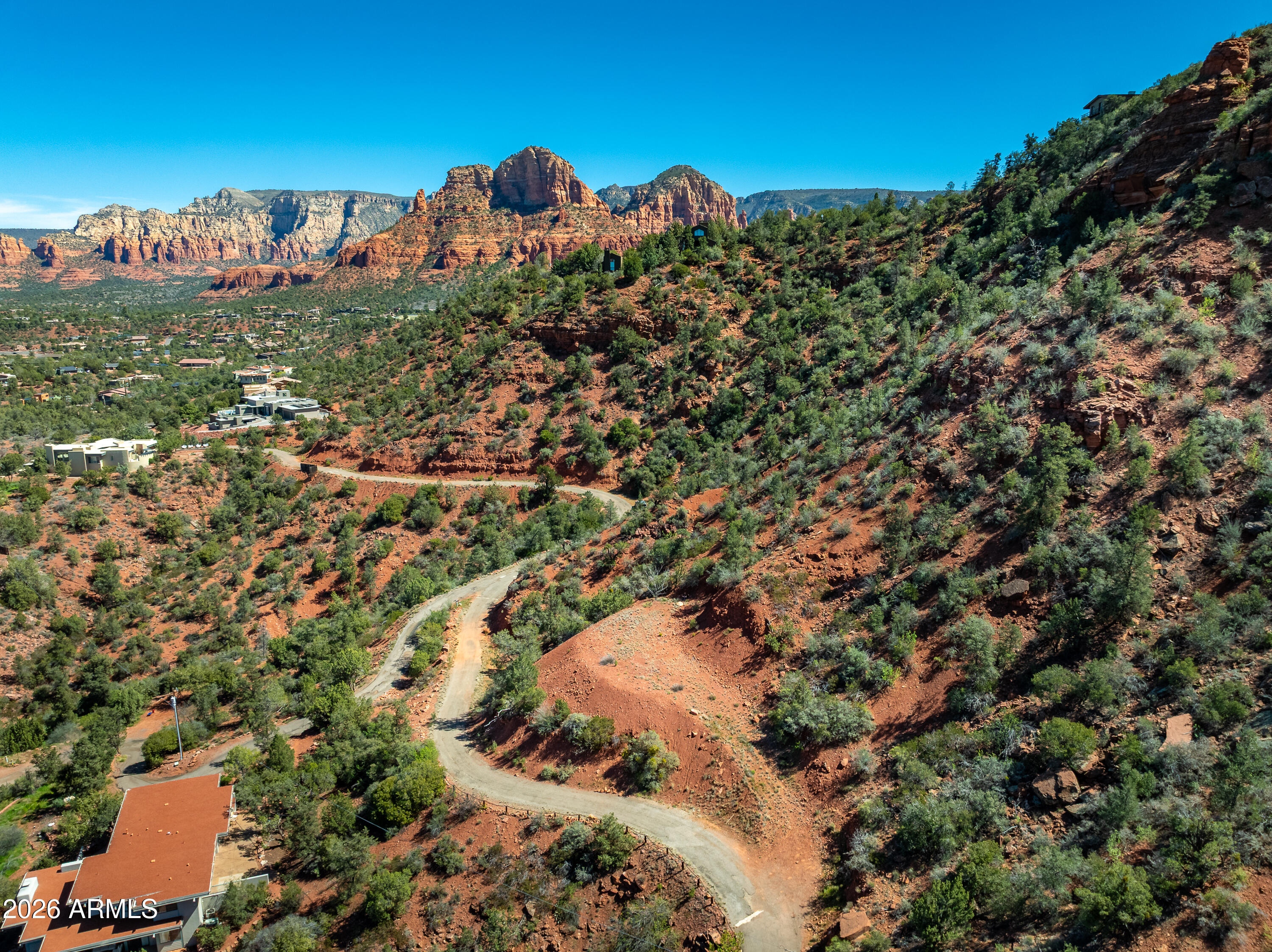Commanding red rock views from this elevated building site with incredible 360 degree red rock views that's also overlooking the rushing waters of Oak Creek and its massive Sycamore and Cottonwood trees.  Unique/highly sought after location has secluded end of the road privacy, yet only a block to National Forest trails and a few minutes from West Sedona or the Village of Oak Creek. Build your dream house at your own pace - choose to build now or wait until you're ready to start construction in the coming months/years.  No time requirement to build. No HOA oversight means you'll only need to comply with city building code and there's no restriction on rentals. Possible Seller financing available.