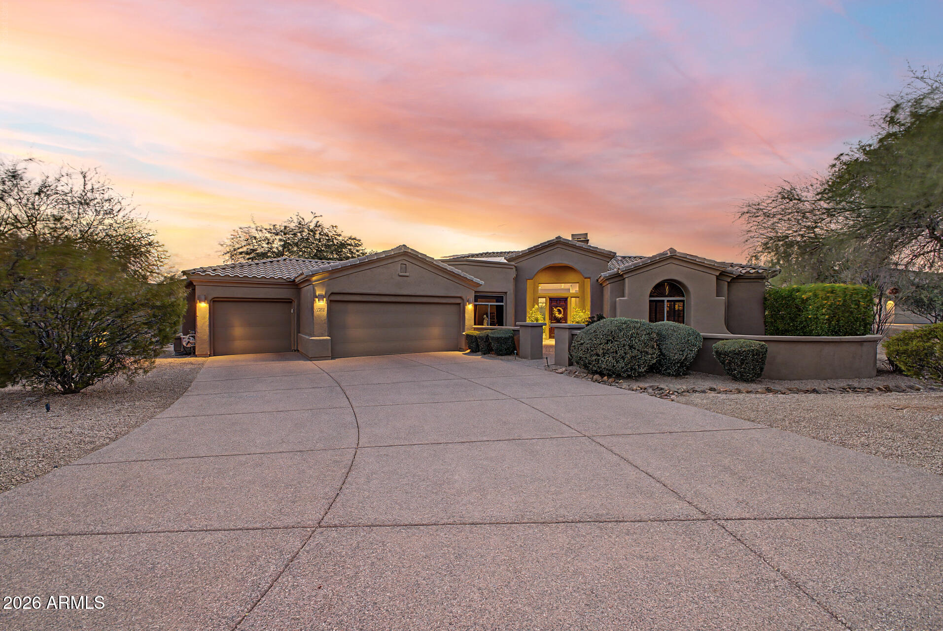 Discover luxury living in this stunning 3,772 sq. ft. home, perfectly situated on nearly an acre in the sought-after gated community of Saguaro Highlands. Built by Toll Brothers, this residence offers an exceptional blend of elegance and comfort. Step inside to experience a spacious great room concept featuring soaring ceilings and huge windows that frame breathtaking desert views, filling the home with natural light. The gourmet kitchen is a chef's dream, complete with two islands, a gas range, double ovens, and a sub-zero style refrigerator, perfect for entertaining. The home includes a formal dining area, a cozy breakfast nook, and a gas fireplace that serves as a warm centerpiece.
The expansive primary suite offers a luxurious retreat, while the backyard oasis is designed for ultimate relaxation. Enjoy the sparkling pool and spa, relax on the paver patio with cool decking, or host gatherings around the fire pit and outdoor kitchen. With a convenient wet bar and multiple seating areas, this home is truly an entertainer's paradise. Don't miss your chance to own this remarkable desert sanctuary.