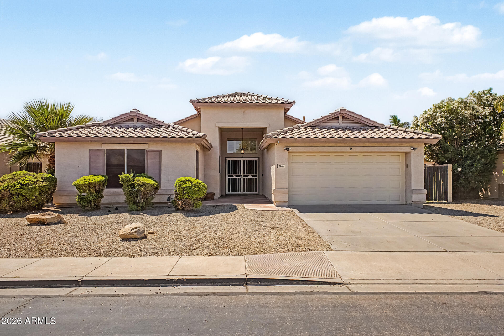 Located on an interior n/s lot, this move-in ready home is within walking distance to the elementary school and offers a functional layout, updated finishes, and a backyard designed for entertaining. Enjoy the benefit of Gilbert schools with Mesa taxes in a highly desirable location. The great-room floor plan includes a formal dining area or den, providing flexible space for a home office, playroom, or additional living area. Interior features include plantation shutters, extensive luxury vinyl plank and tile flooring, and a clean, updated feel throughout. The updated kitchen offers a large island with breakfast bar, granite slab countertops, abundant white cabinetry with hardware, pantry storage, and stainless-steel appliances--ideal for everyday living and hosting. The spacious owner's suite features vaulted ceilings and a private exit to the backyard, while the updated bathroom includes quartz countertops and modern fixtures. Two secondary bedrooms include walk-in closets, providing added storage and flexibility. Step outside to a backyard built for Arizona living, featuring a large covered patio with ceiling fan, synthetic grass, and a PebbleTec pool with rock waterfall--perfect for relaxing or entertaining. Additional highlights include a 2-car garage with epoxy floors and an RV gate. If you're searching for a home with a pool, RV gate, updated kitchen, and Gilbert schools in East Mesa, this property offers comfort, convenience, and strong overall value.