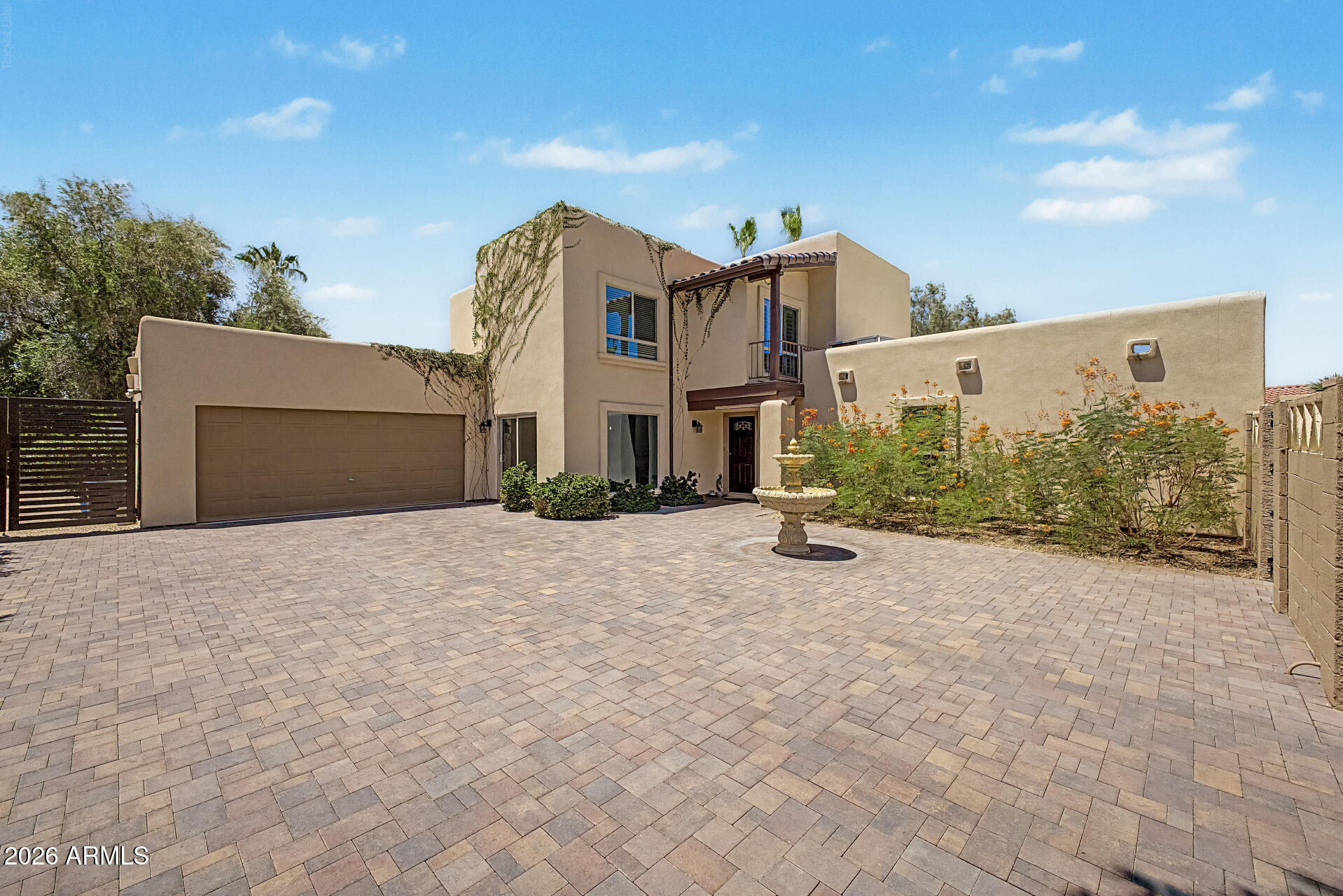 Don't miss this rare opportunity to own a beautiful home in the sought after Santiago subdivision of Scottsdale's coveted 85254 zip code. Designed by renowned architect Bob McIntyre, known for creating the iconic Tlaquepaque Arts & Shopping Village in Sedona AZ. This turnkey property is nicely updated and has been operating as an active short-term rental without Scottsdale's restrictive guidelines. Sellers are willing to include all furnishings with the right offer! Ideally situated near premier shopping, golf courses, the Mayo Clinic, and within walking distance to parks and schools. Drive through the modern gates into a charming private courtyard with a beautiful fountain. Inside, you'll find the perfect tile flooring, vaulted ceilings, and updated energy efficient windows throughout. The gourmet kitchen features granite countertops, stainless steel appliances, and a breakfast bar perfect for entertaining. The main-level primary suite provides comfort and privacy, while upstairs offers a spacious loft, two additional bedrooms with bamboo flooring, and a Jack-and-Jill bathroom. The two-car garage includes built-in cabinetry and epoxy flooring. The resort-style backyard is your own private paradise featuring an outdoor kitchen, easy to maintain artificial turf, mature fruit trees, travertine pool decking, and a diving pool designed for Arizona living at its finest.