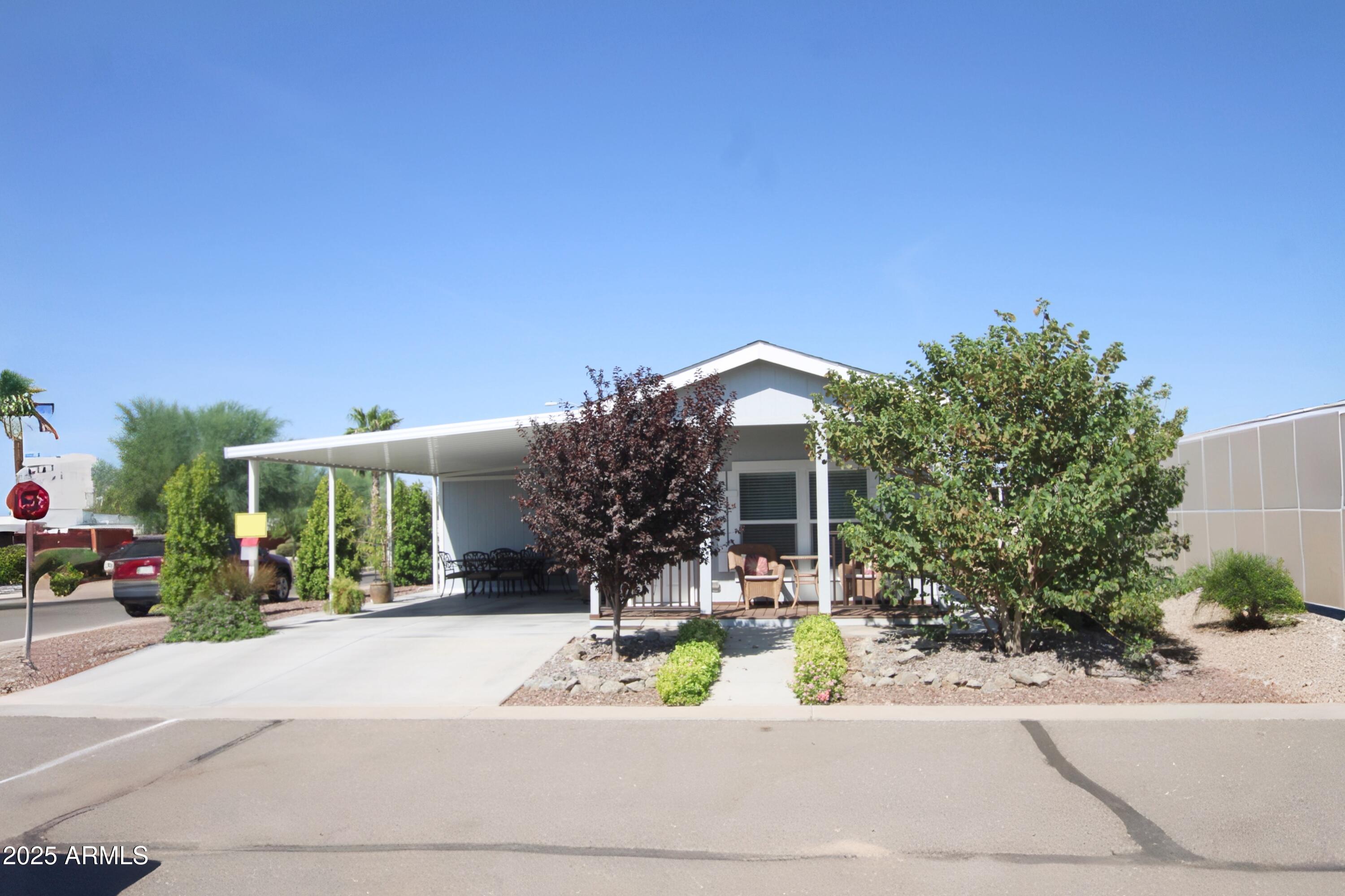 Courtesy Listing for MGN Homes - Michelle Traphagan, Sales * Located in Sundance 2, in the Sundance 1 RV Resort 55+ Community.
Features: 2 BEDROOM, 1 BATH ^ 9' CEILINGS ^ 39'' OVERHEAD CABINETS ^ 4 UPGRADED ^ APPLIANCES ^ LED RECESSED LIGHTING IN KITCHEN ^ STACKABLE WASHER & DRYER - updated 2023 ^ CEILING FANS / LIGHTS
WALK IN SHOWER ^ VINYL PLANK FLOORING ^ ISLAND IN KITCHEN ^ NEW HARDWARE IN BATHROOM -updated in 2024 ^ LAMINTATE COUNTER TOPS UNFURNISHED  ^ 674 SF with Porch
EXTERIOR:
EAST FACING, CORNER LOT ^ 18' X 54' DOUBLE DRIVE ^ 18' X 44' DOUBLE AWNING
10' X 12' WIRED SHED  ^ WHITE VINYL DUAL GLAZE LOW E WIND ^ IRRIGATION SYSTEM ^ HEAT PUMP ^ GUTTERS ON NON-AWNING SIDE ^ 16' DECK ON FRONT OF HOME ^ LANDSCAPING W TREES ^ ASSUMABLE TERMITE CONTRACT