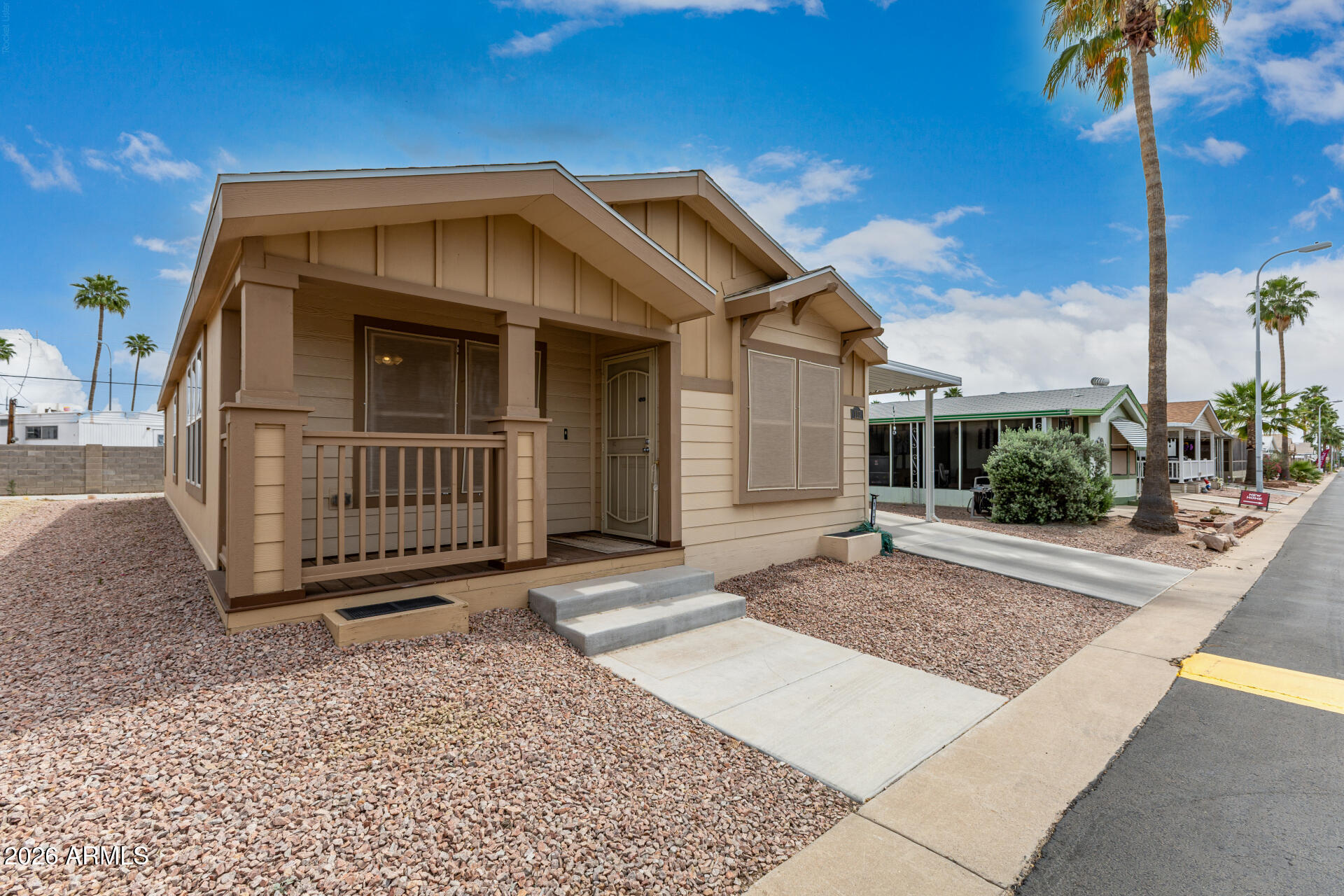 Motivated Seller!! Move in ready 3 bed, 2 bath home in the desirable Holiday Palms 55 plus community. This well-kept property features a bright living area, ample kitchen storage and a spacious primary suite. Enjoy an expansive patio for covered parking, and onsite storage shed. Conveniently located minutes from major freeways and the airport, this active community offers a heated pool, spa, fitness center, pickleball and more.
