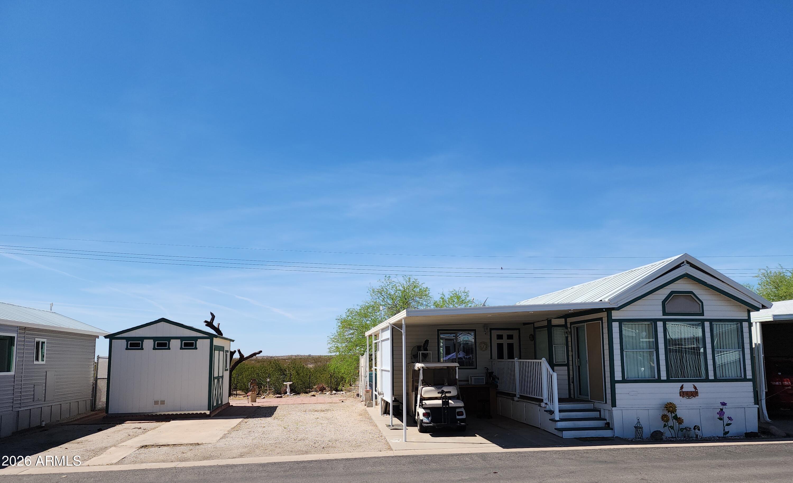 A rare find, 2-lots on the desert at 3538 & 3540 N Chapparel Dr. in Caliente, a 55+ community where you own your land so no lot rent. A 397 sq ft 1996 Chapparel park model with a 15 X 15 AZ room for another 225 sq ft of living space. Even a 10' X 12'Tuff Shed on the vacant lot. The home backs up to the desert looking west to enjoy those beautiful sunsets from your backyard. The home is furnished and the AZ room has a large flat screen TV, a half-bath, a stack washer/dryer and waiting for you on how to utilize the space. 1 block walk to pool #4. Caliente has a large club house that serves many meals and event during the season. Theres horseshoe pits, twin pickleball courts and a club for almost every interest group and executive golf course 3 blocks from the park. Come check it out!