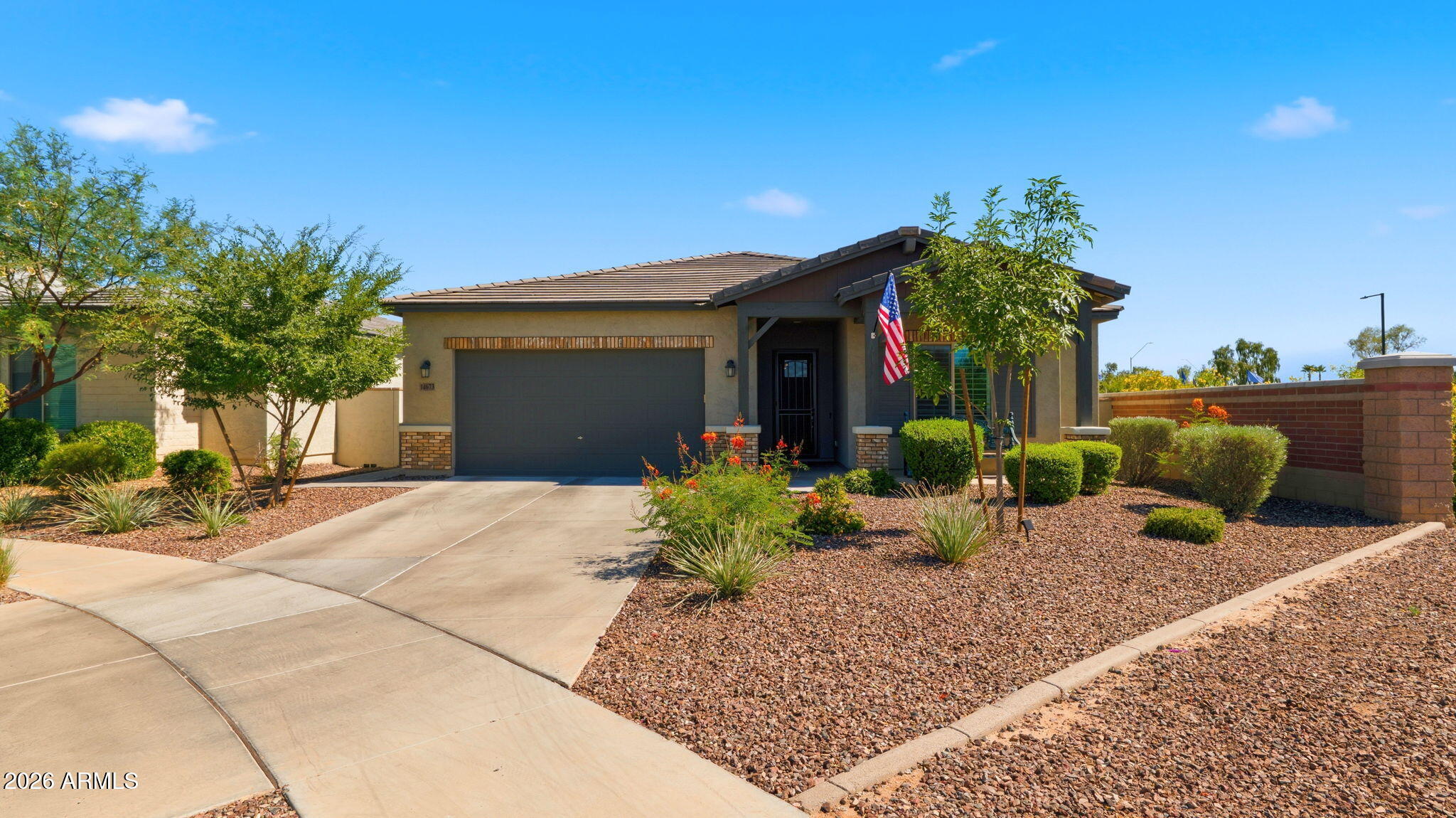 Beautifully upgraded home in the highly sought-after Homestead at Marley Park community! Situated on a premium corner lot with only one neighbor, this move-in-ready home offers added privacy and an open feel. Freshly painted throughout with brand-new bedroom flooring and no carpet anywhere. Features upgraded 4.5-inch baseboards and stunning leather-finish granite countertops in the kitchen and bathrooms. The chef's kitchen offers abundant prep space and premium finishes. Enjoy your private backyard retreat with a pergola, built-in outdoor kitchen, fireplace, stone-surround hot tub, and misting system. Additional upgrades include a water softener, reverse osmosis system, and brand-new epoxy garage floor.