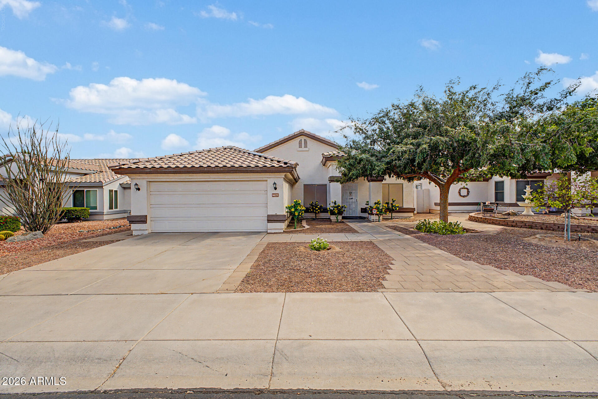 Seize the chance to own this lovely 4-bedroom, 2-bath home with no HOA! Discover an inviting living room with vaulted ceilings, a soothing palette, and durable tile flooring. Cook delicious meals in the eat-in kitchen, equipped with ample wood cabinets, canned lighting, stainless steel appliances, and an island with a breakfast bar for casual dining. The primary bedroom features sliding door access to the backyard for seamless indoor-outdoor flow, an ensuite with dual sinks, and a walk-in closet. Imagine peaceful afternoons in the backyard, complete with a spacious open patio and mature trees that provide natural shade. Don't miss out on this fantastic opportunity!